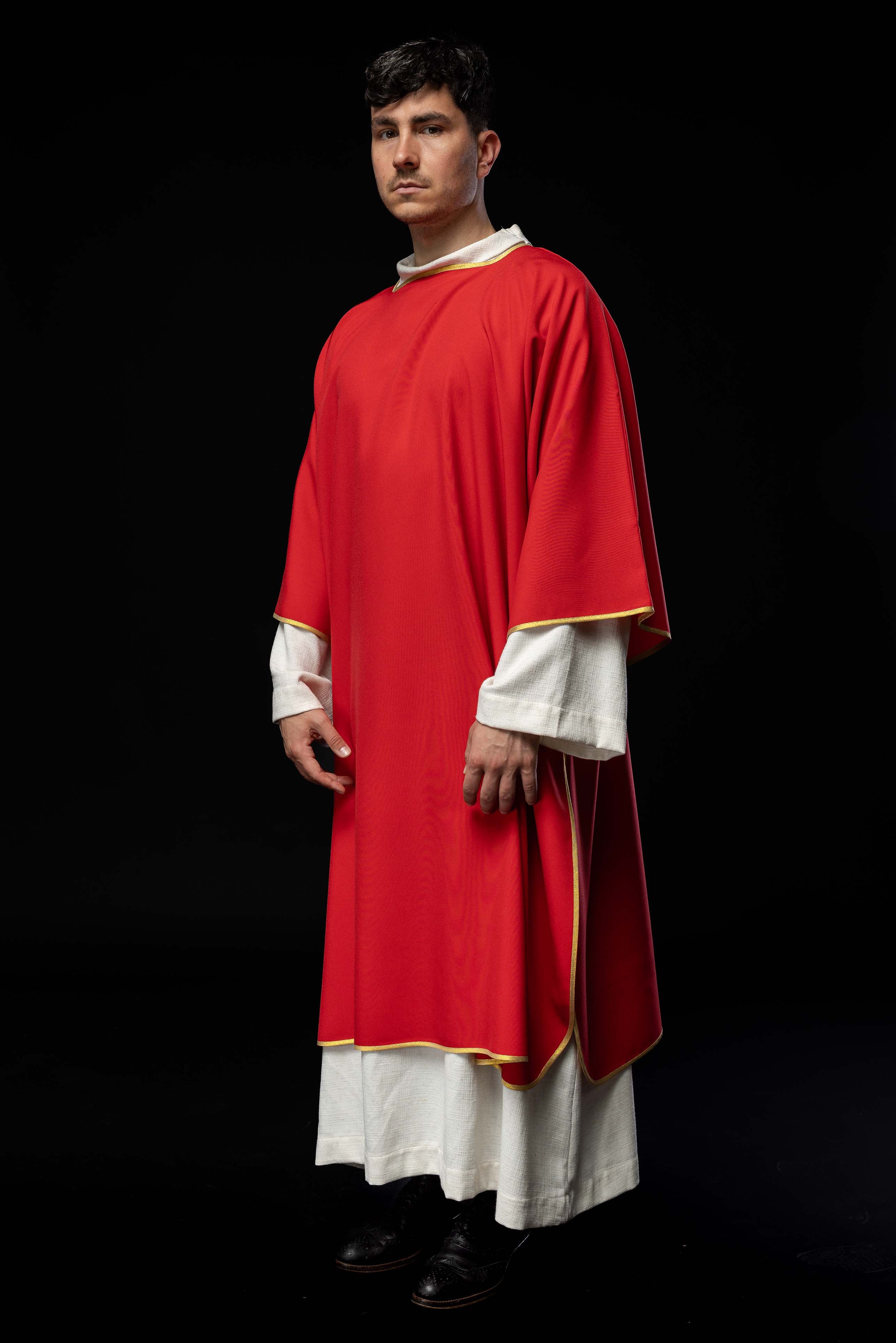 Plain dalmatic in red with gold trim