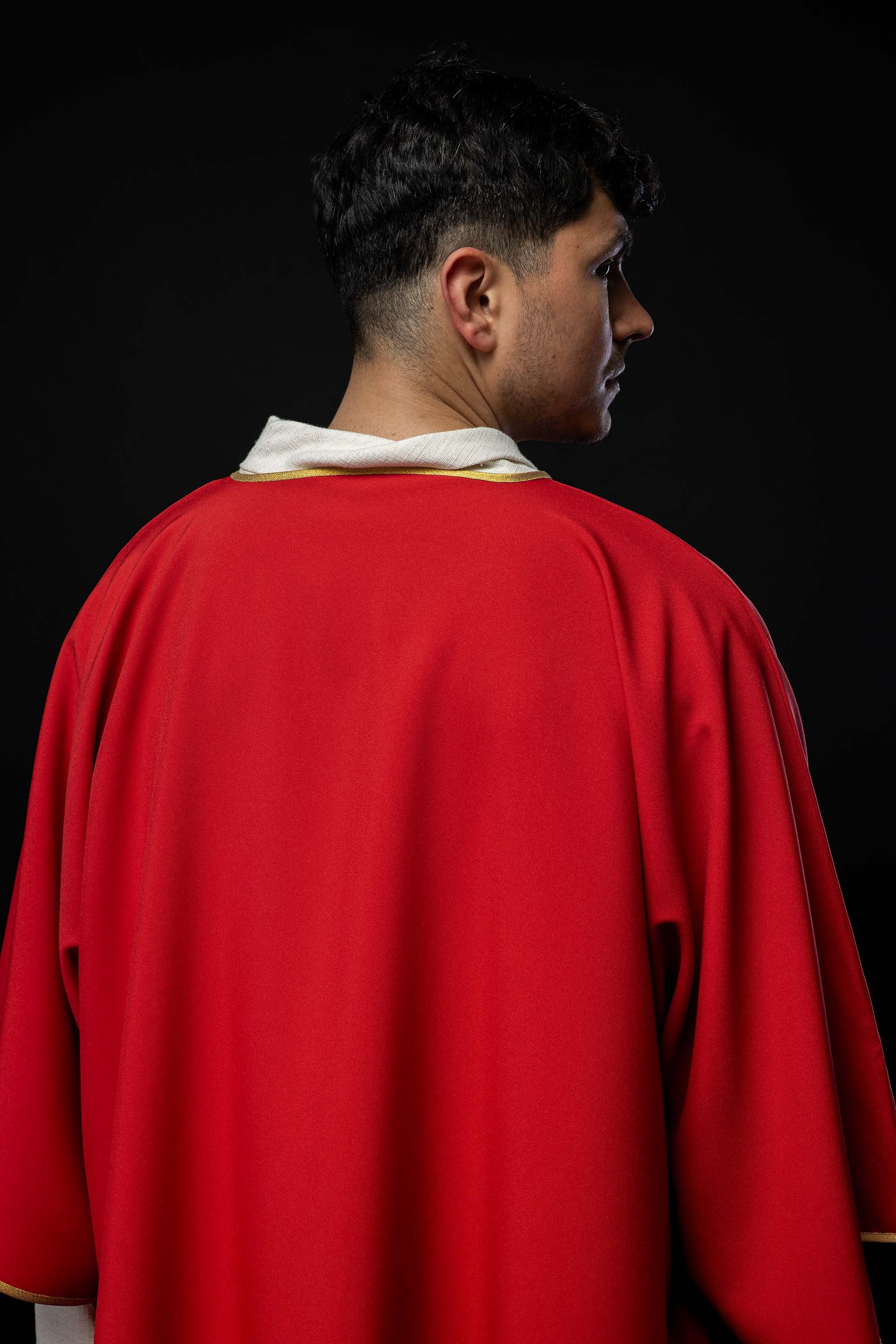Plain dalmatic in red with gold trim