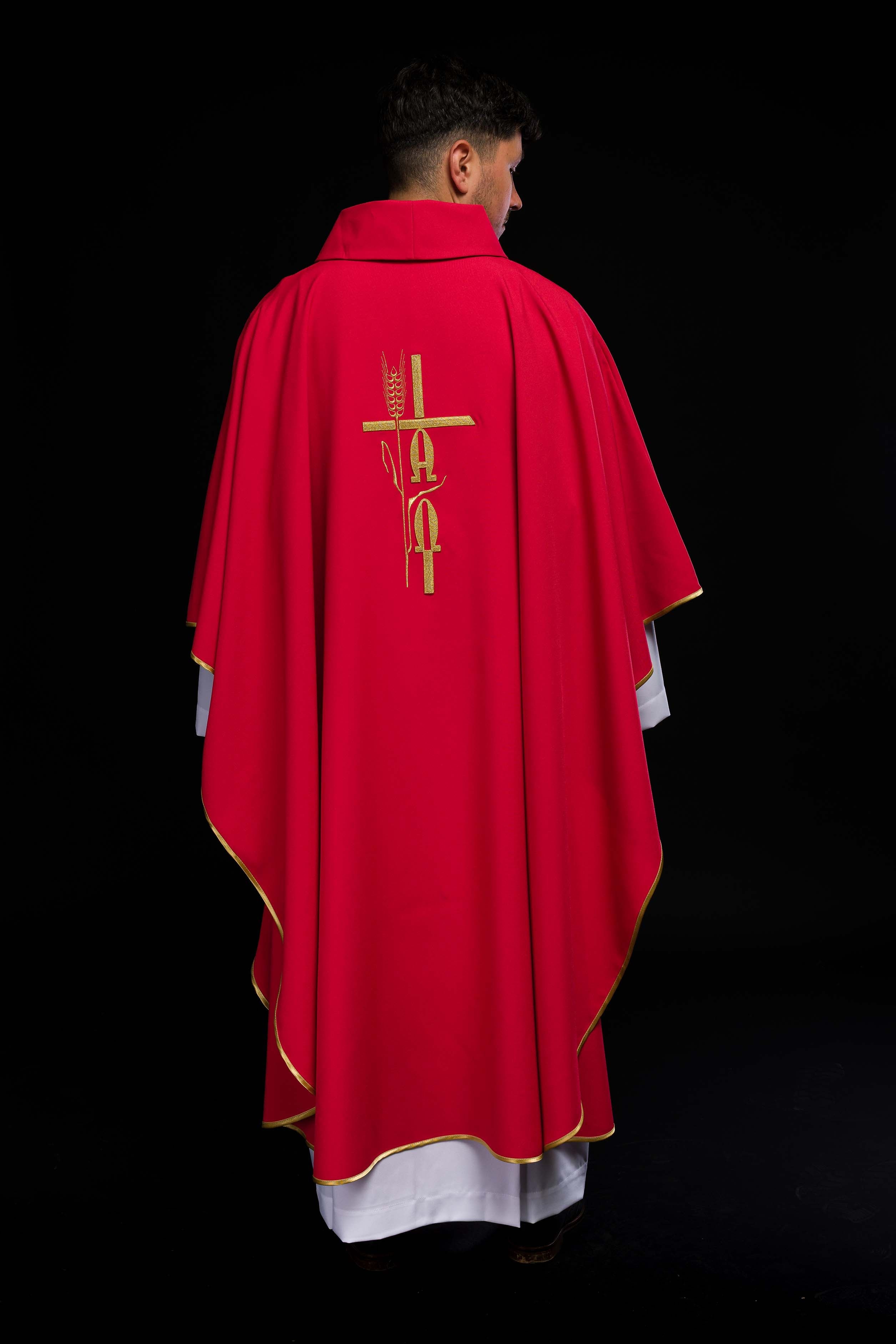 Red chasuble with cross and alfa omega symbols
