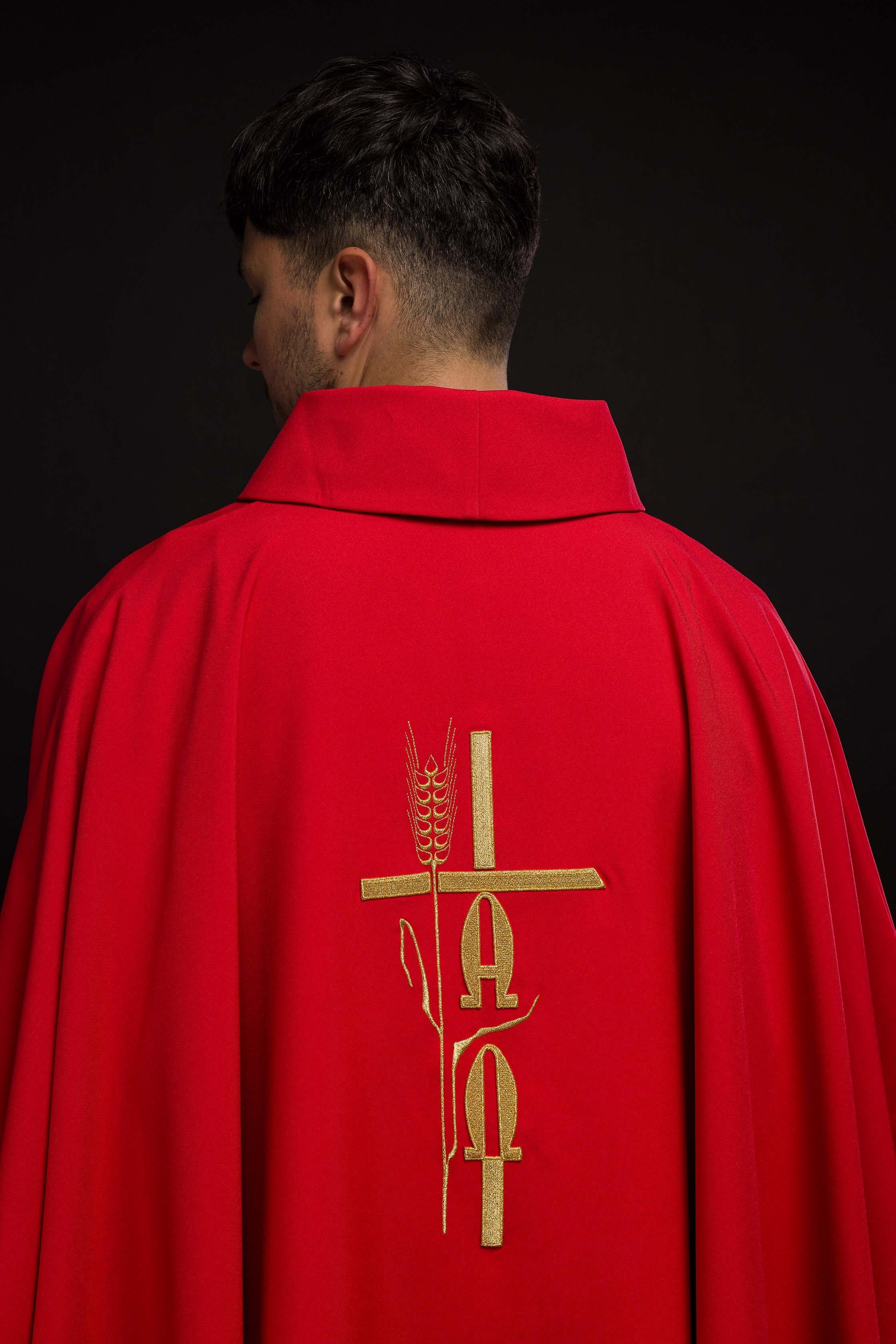 Red chasuble with cross and alfa omega symbols