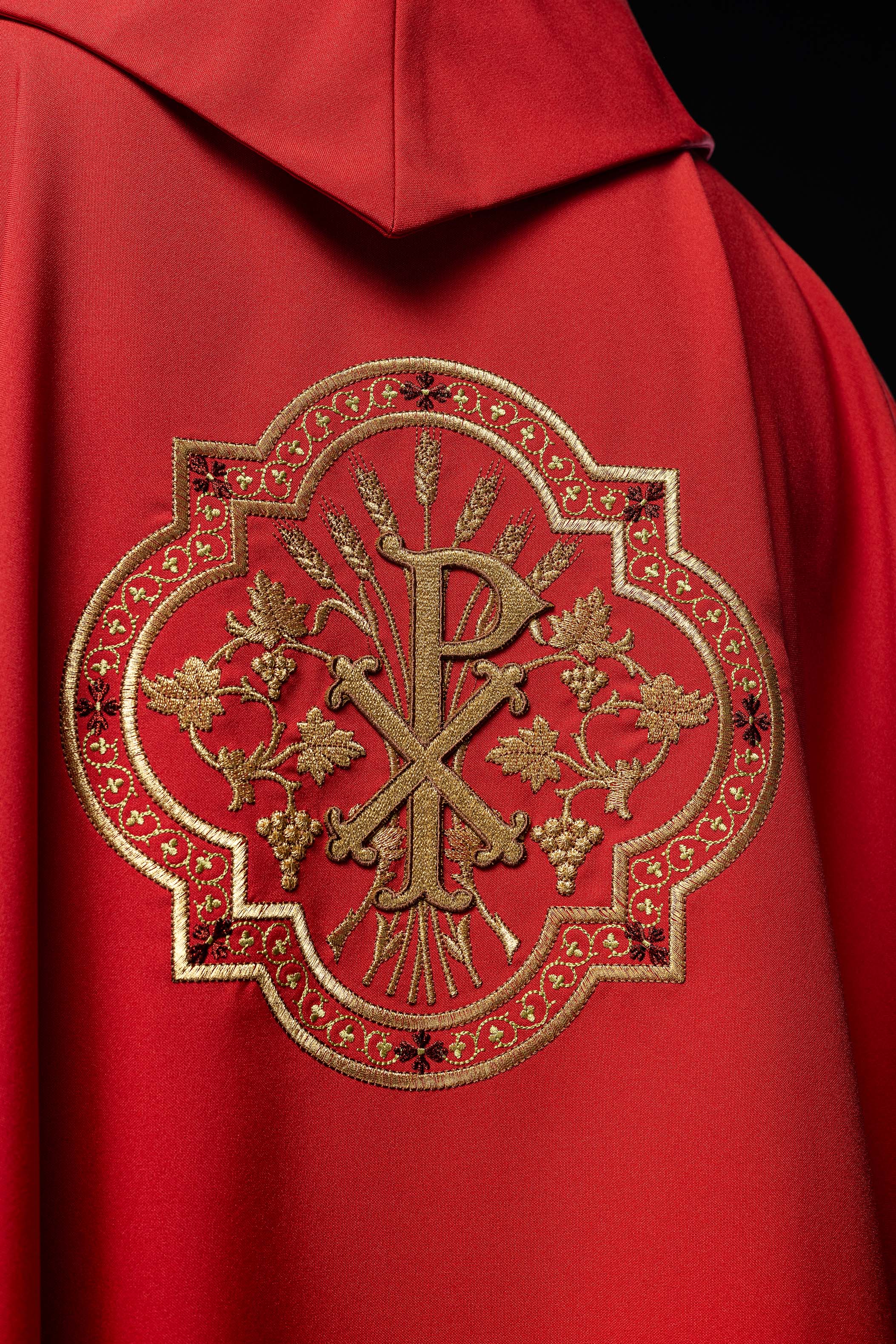 Red chasuble with IHS and PAX embroidery
