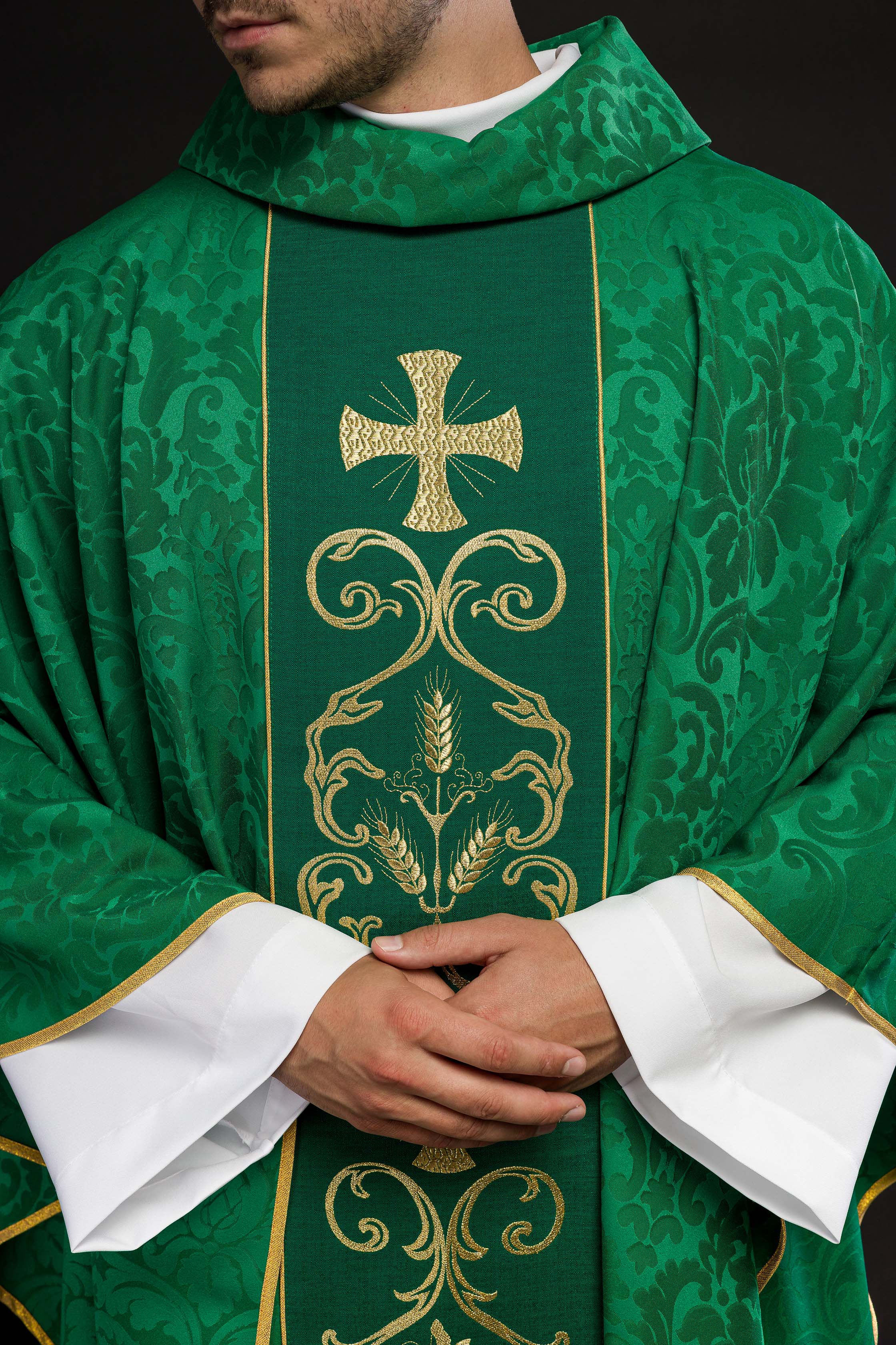 Green liturgical chasuble decorated with an embroidered belt