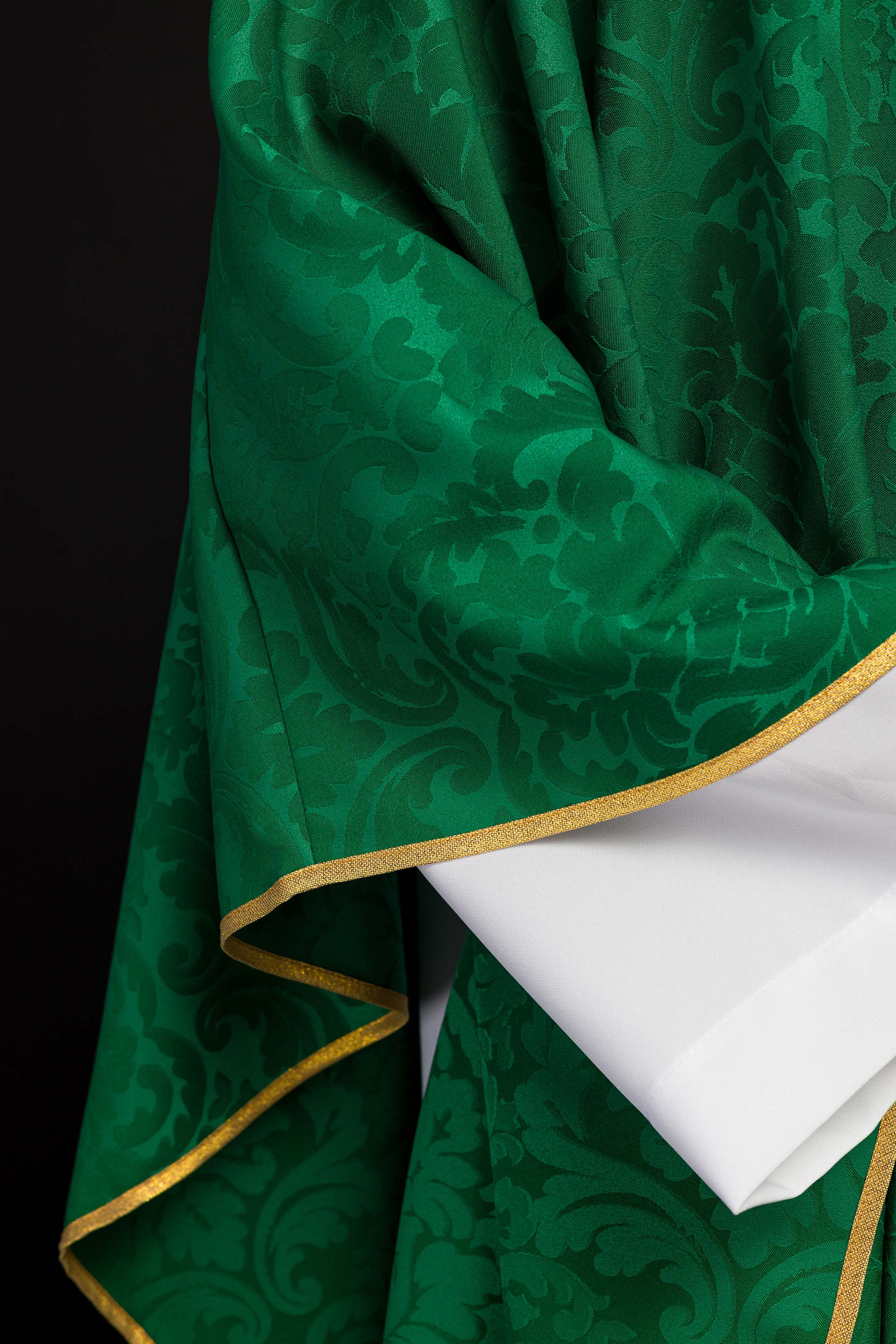 Green liturgical chasuble decorated with an embroidered belt