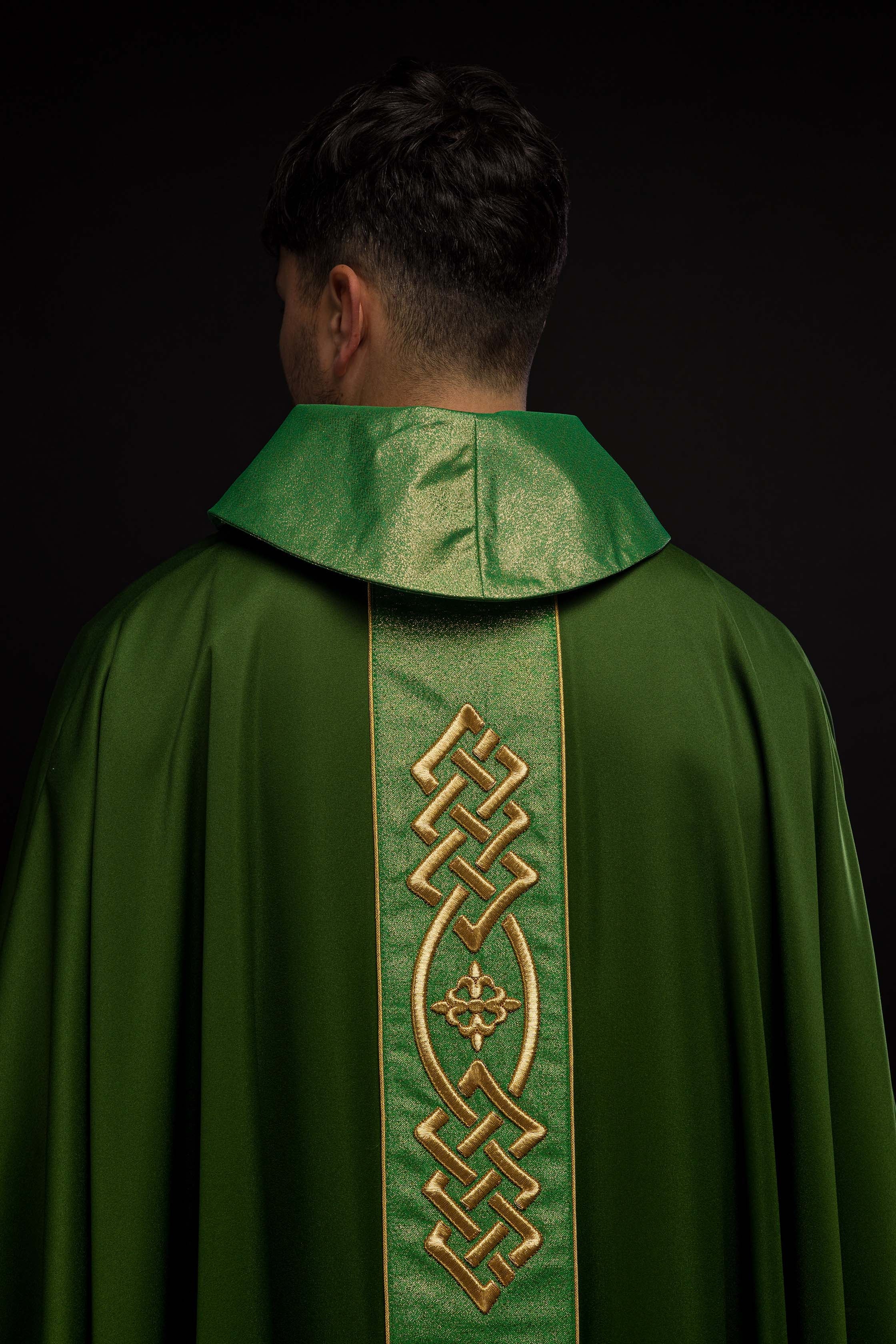 Richly embroidered green chasuble