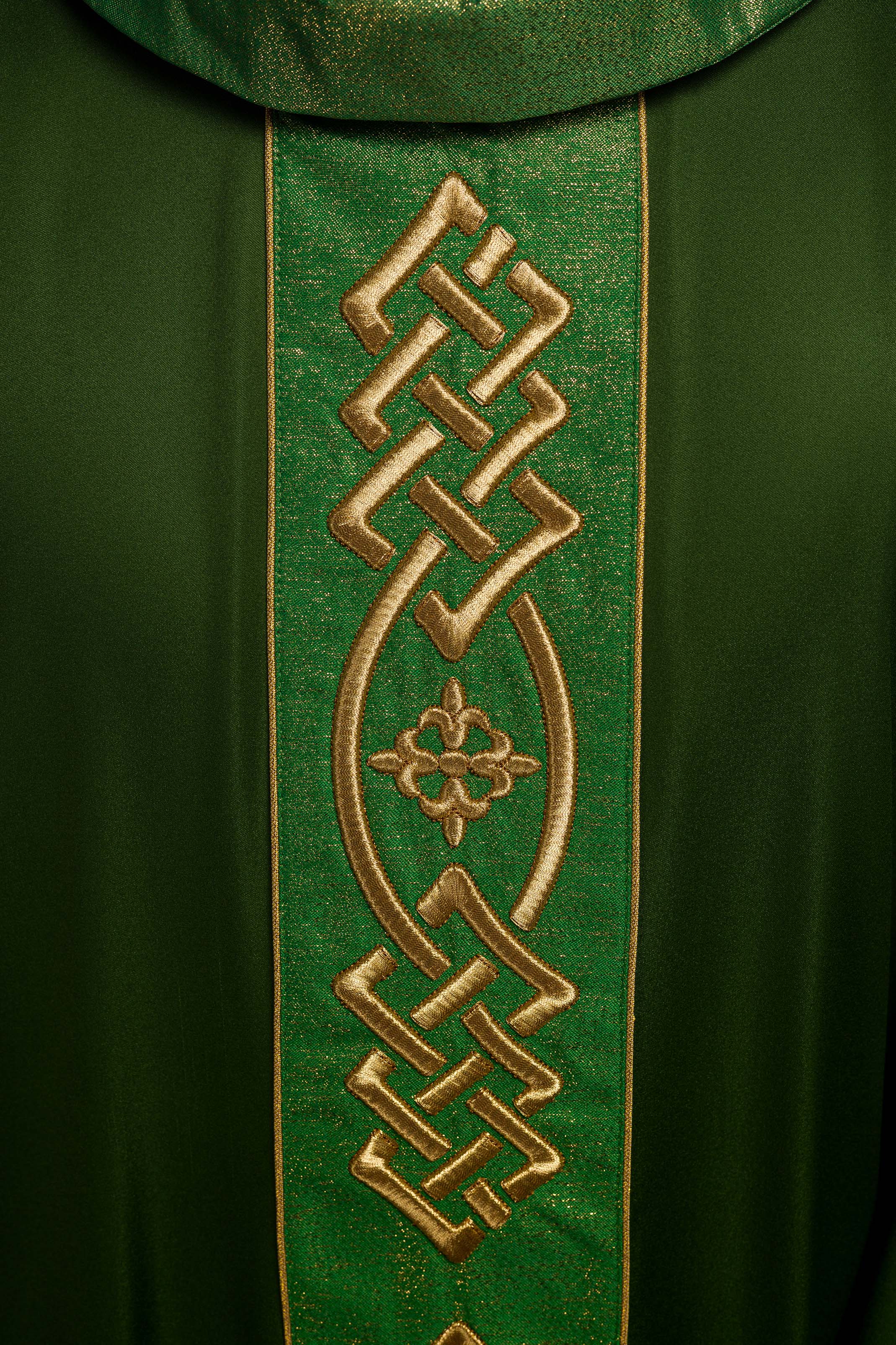 Richly embroidered green chasuble