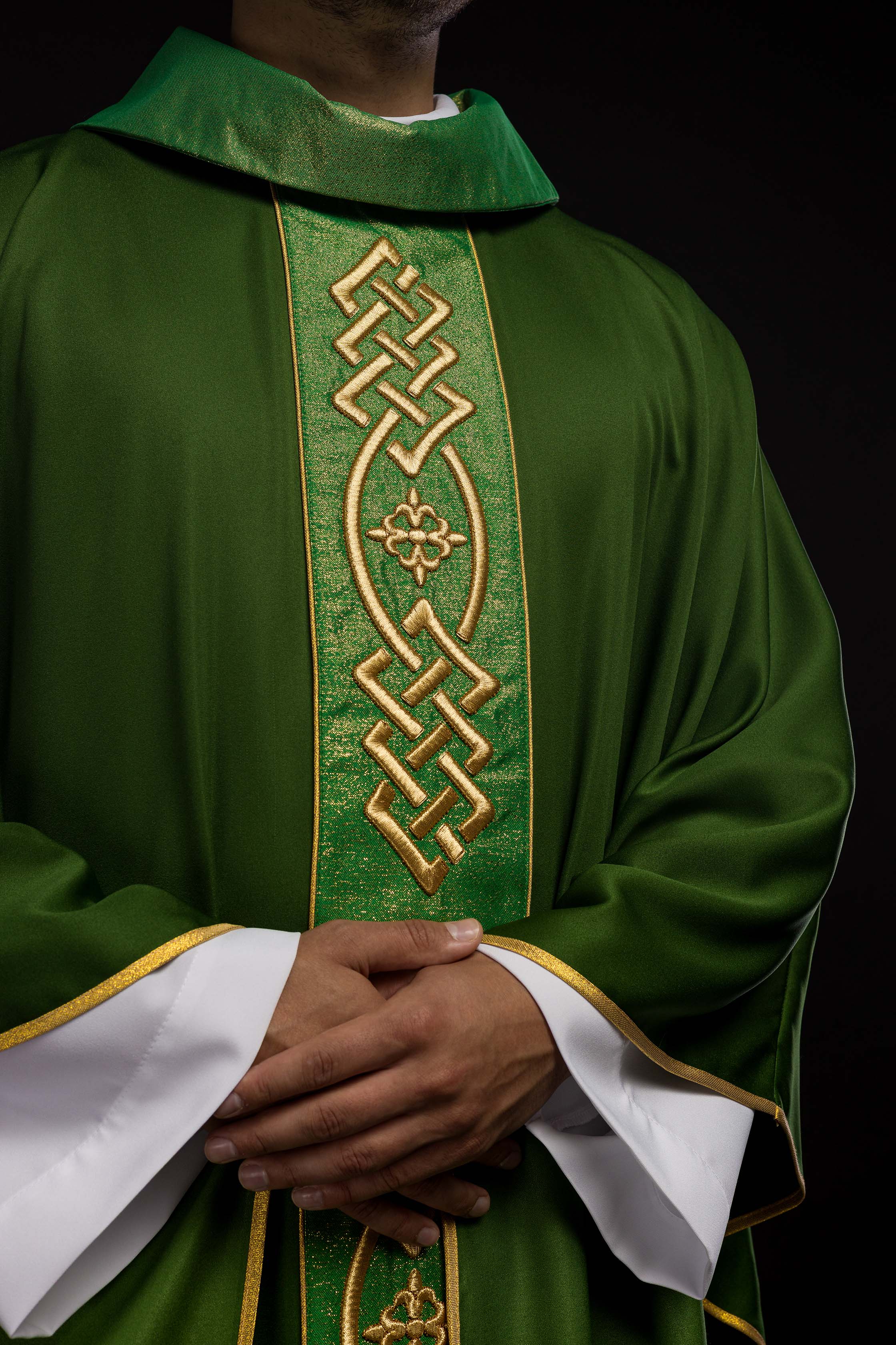 Richly embroidered green chasuble