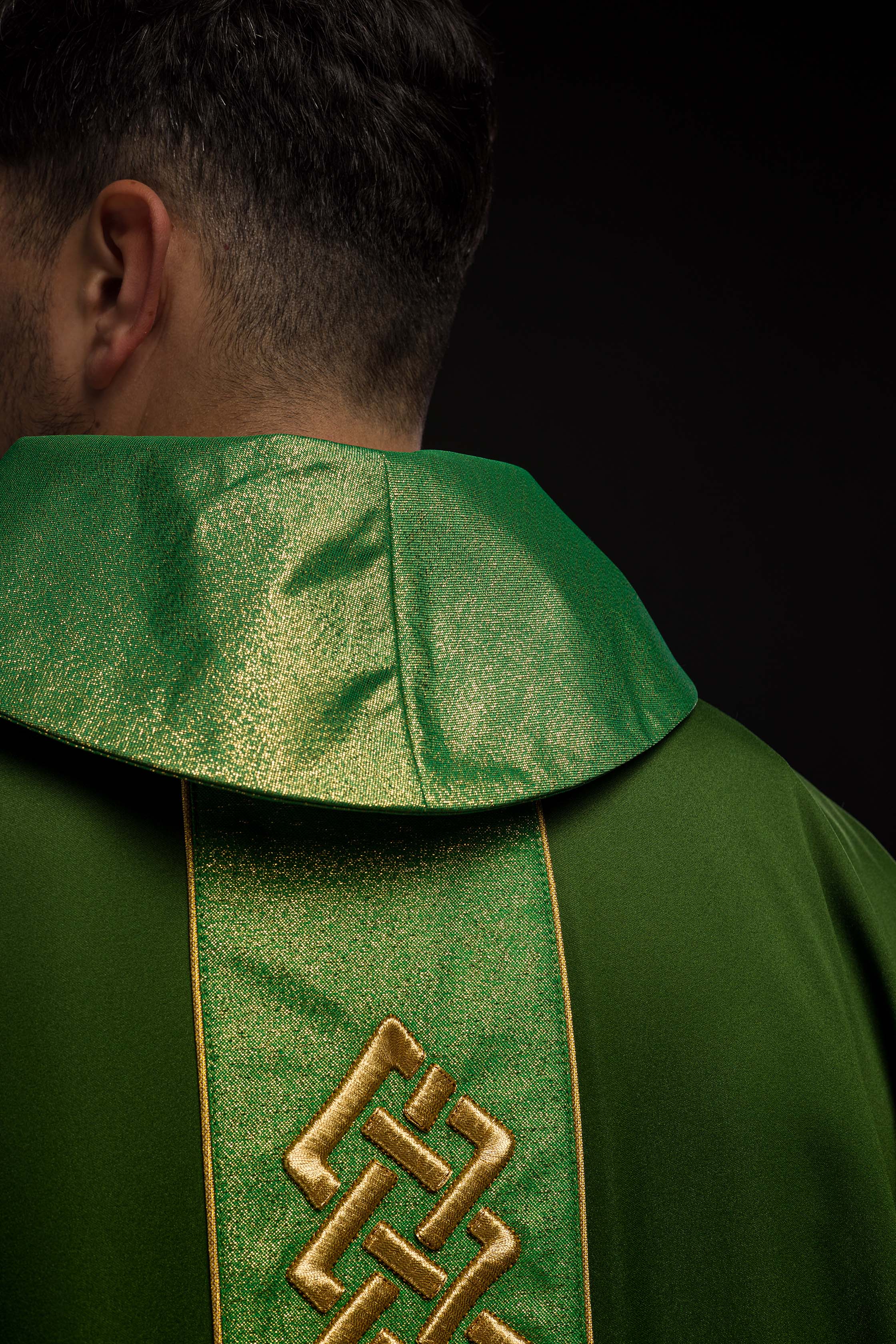 Richly embroidered green chasuble