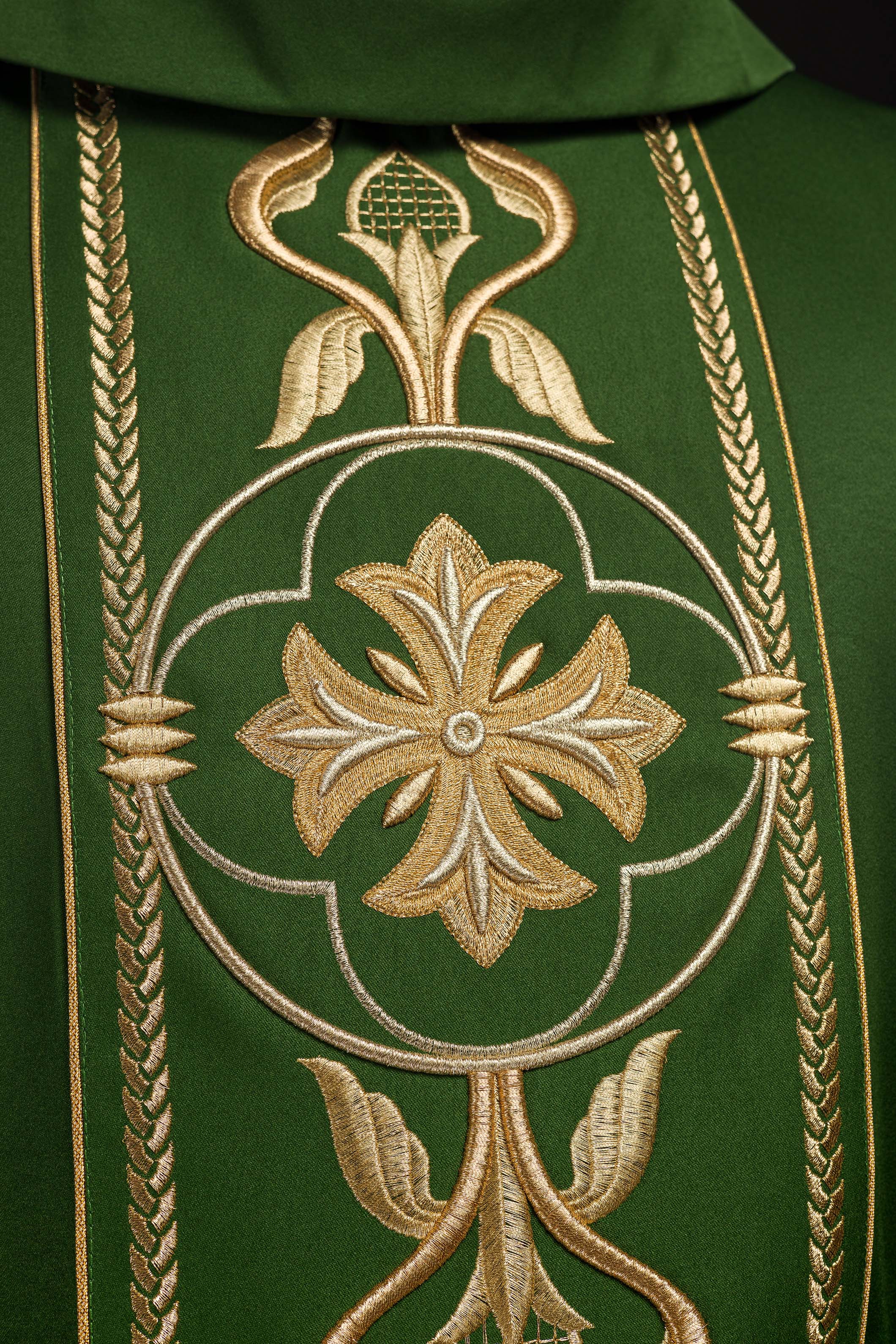 Richly embroidered green chasuble