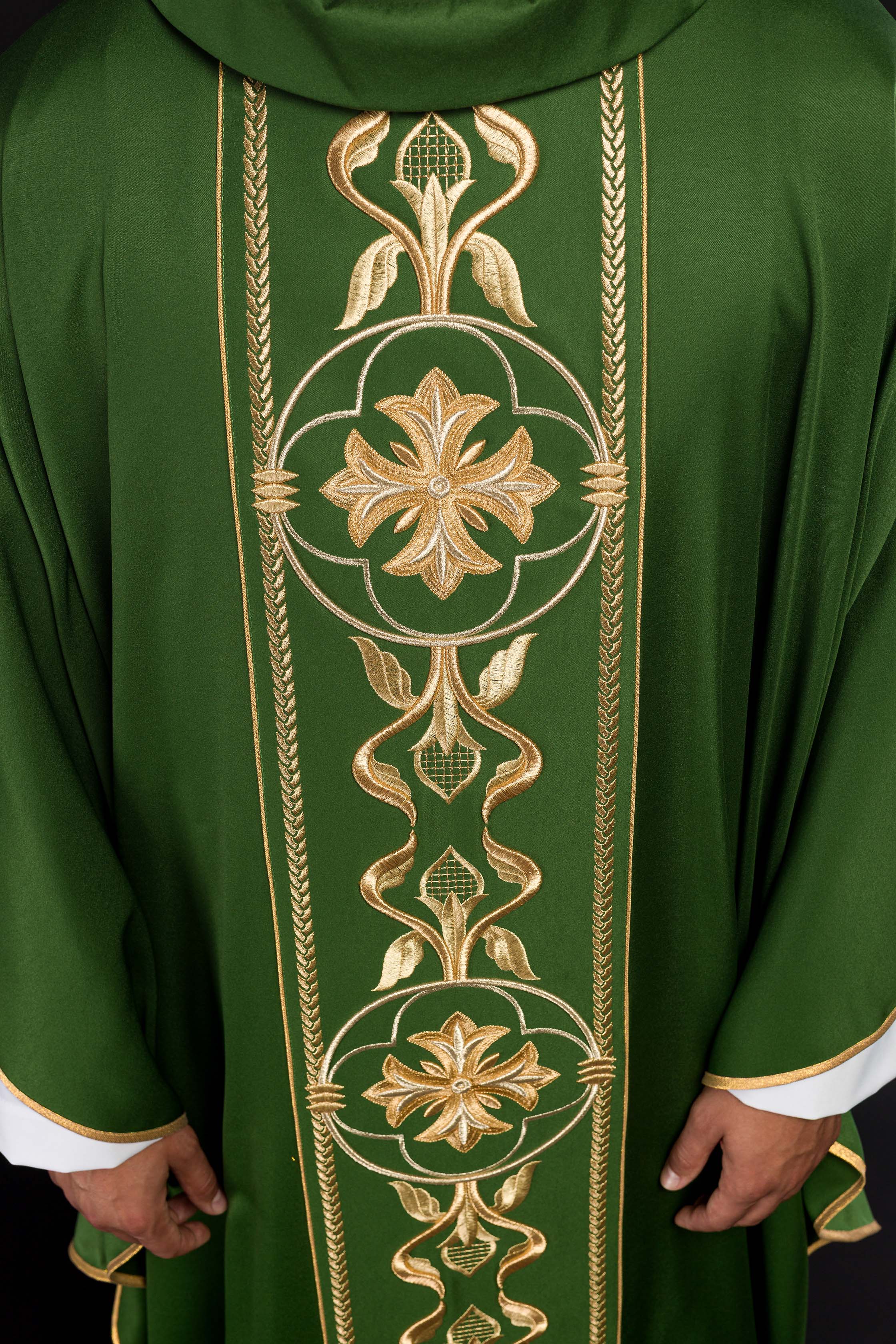 Richly embroidered green chasuble
