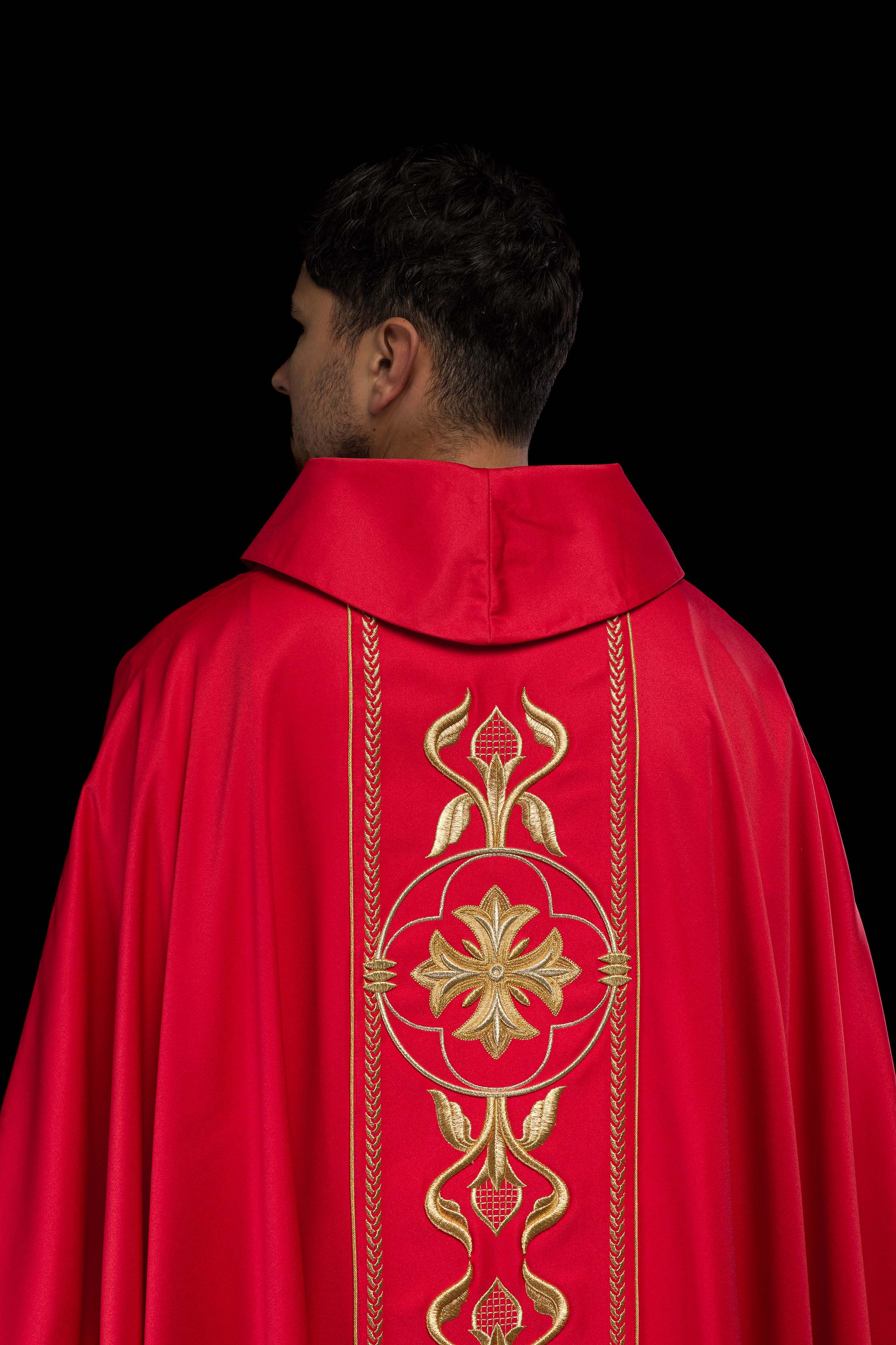 Embroidered red chasuble with decorative band