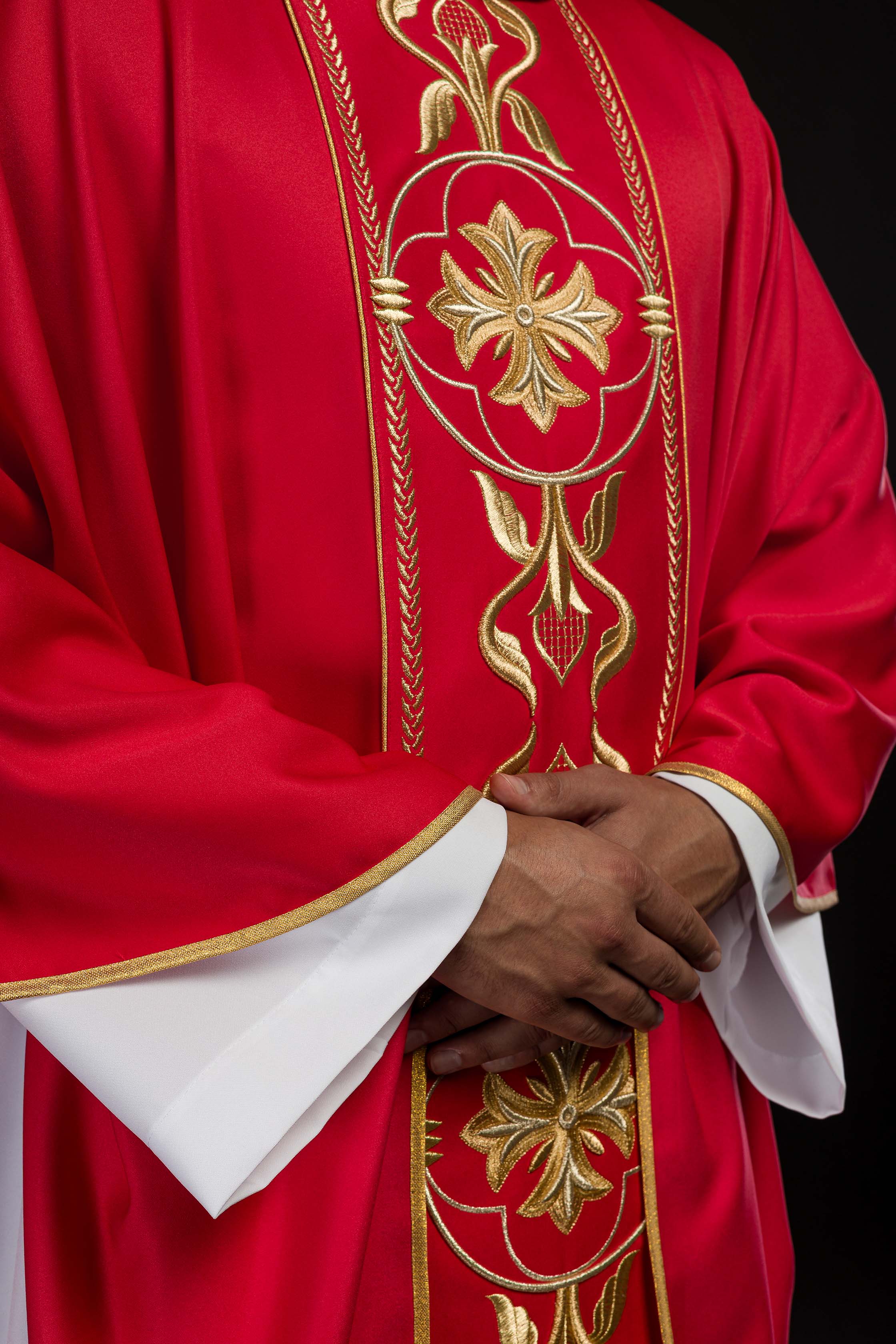 Embroidered red chasuble with decorative band