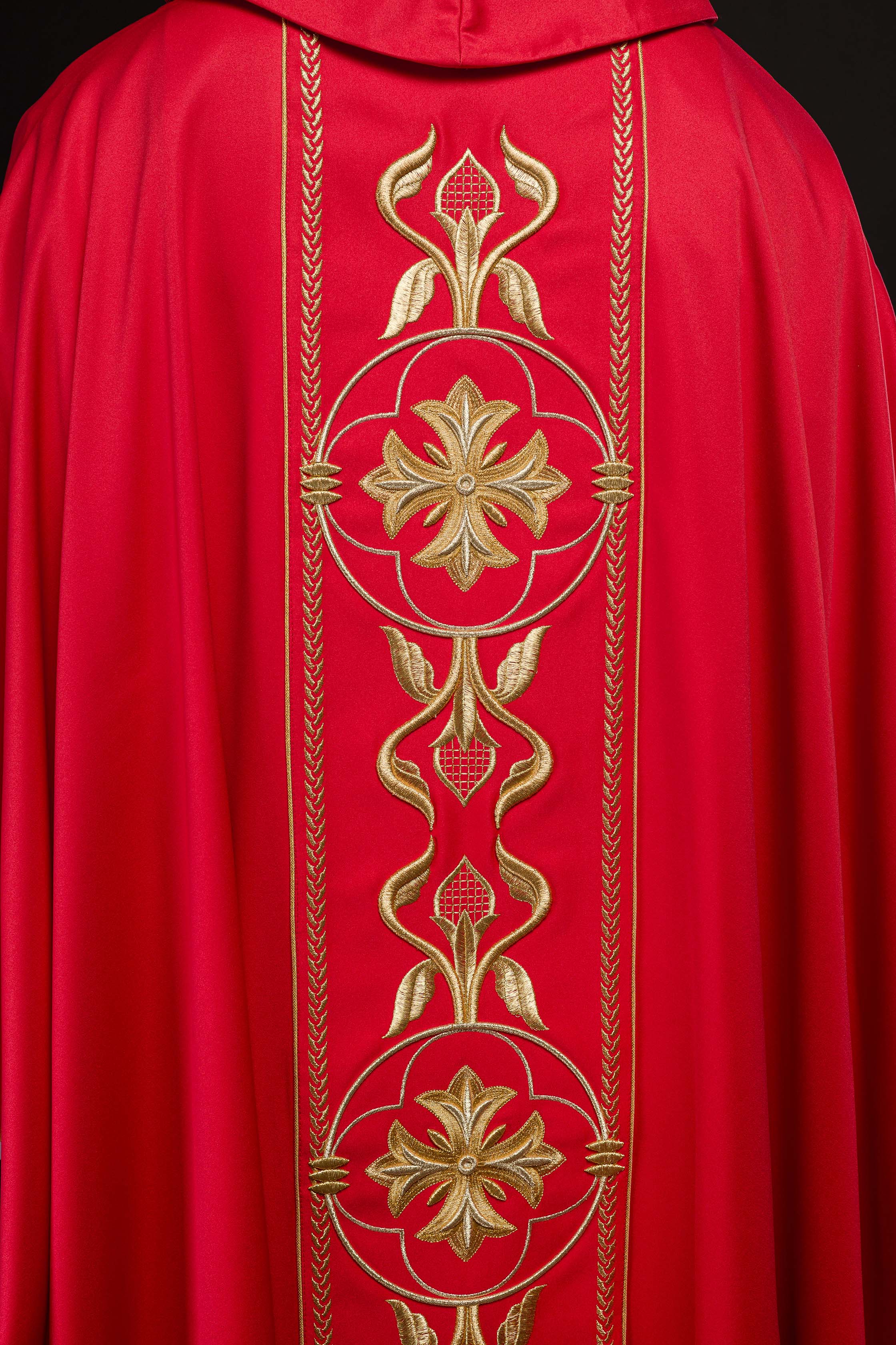 Embroidered red chasuble with decorative band