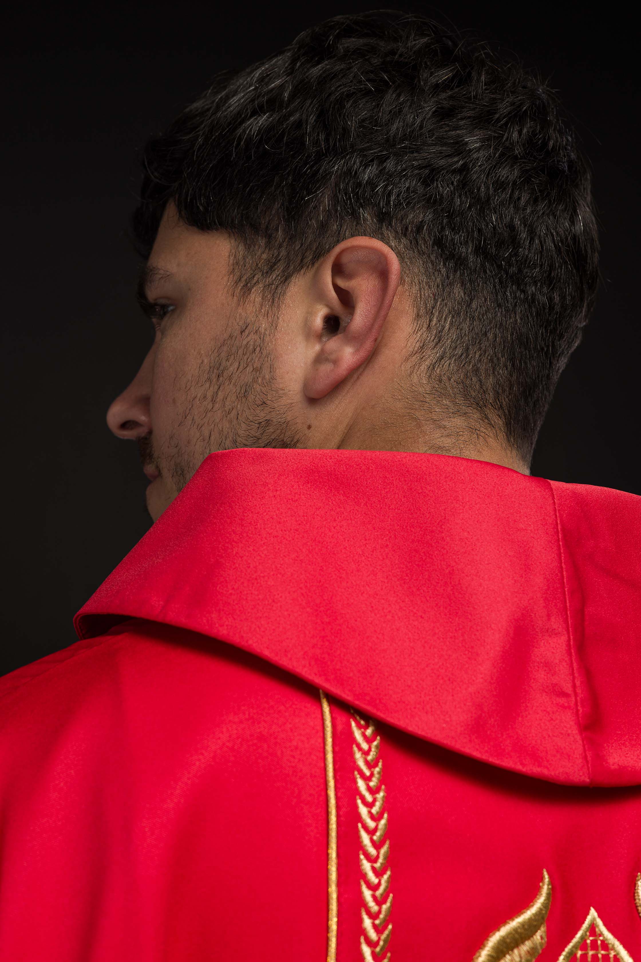 Embroidered red chasuble with decorative band