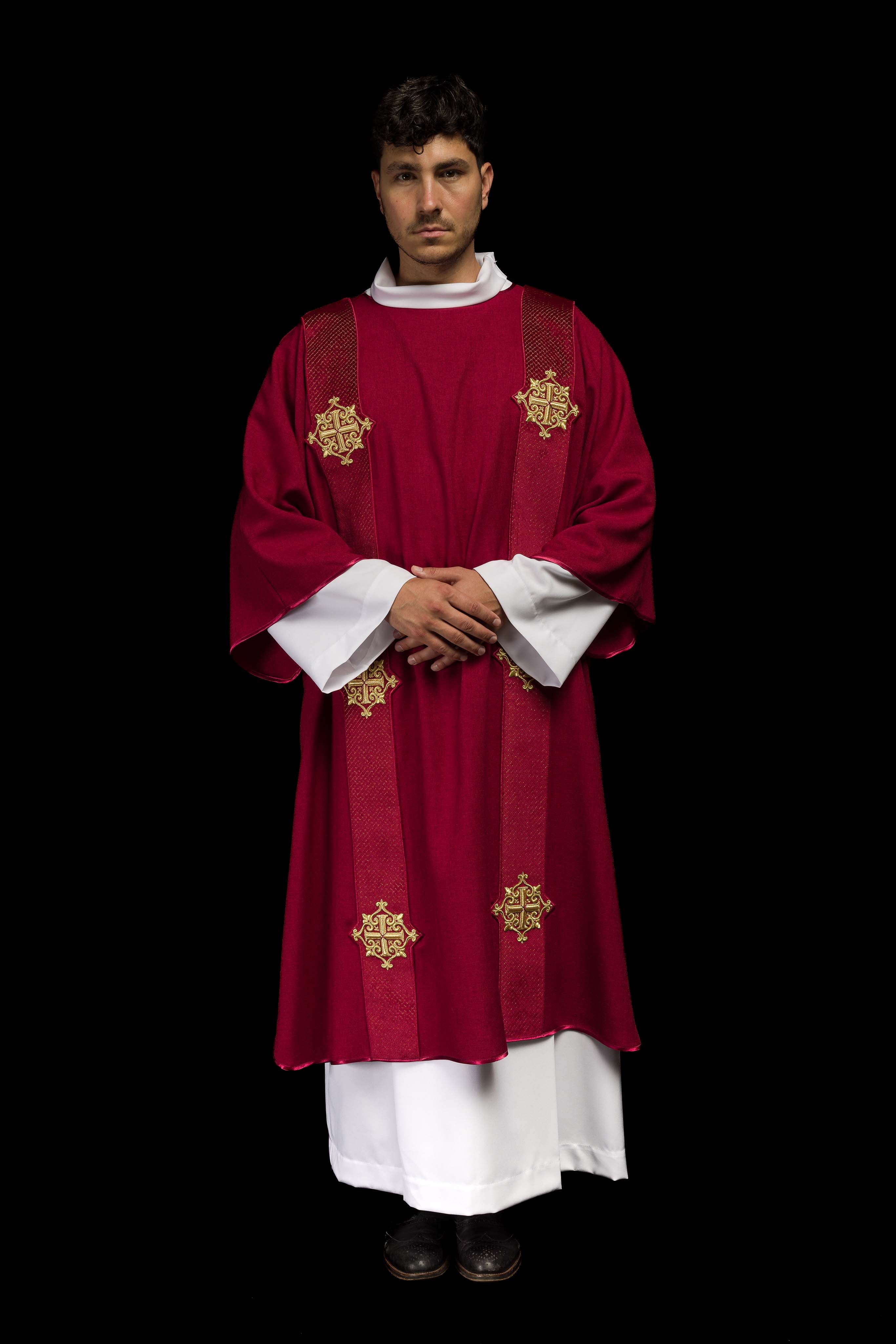 Red dalmatic with velvet bands and cross symbols