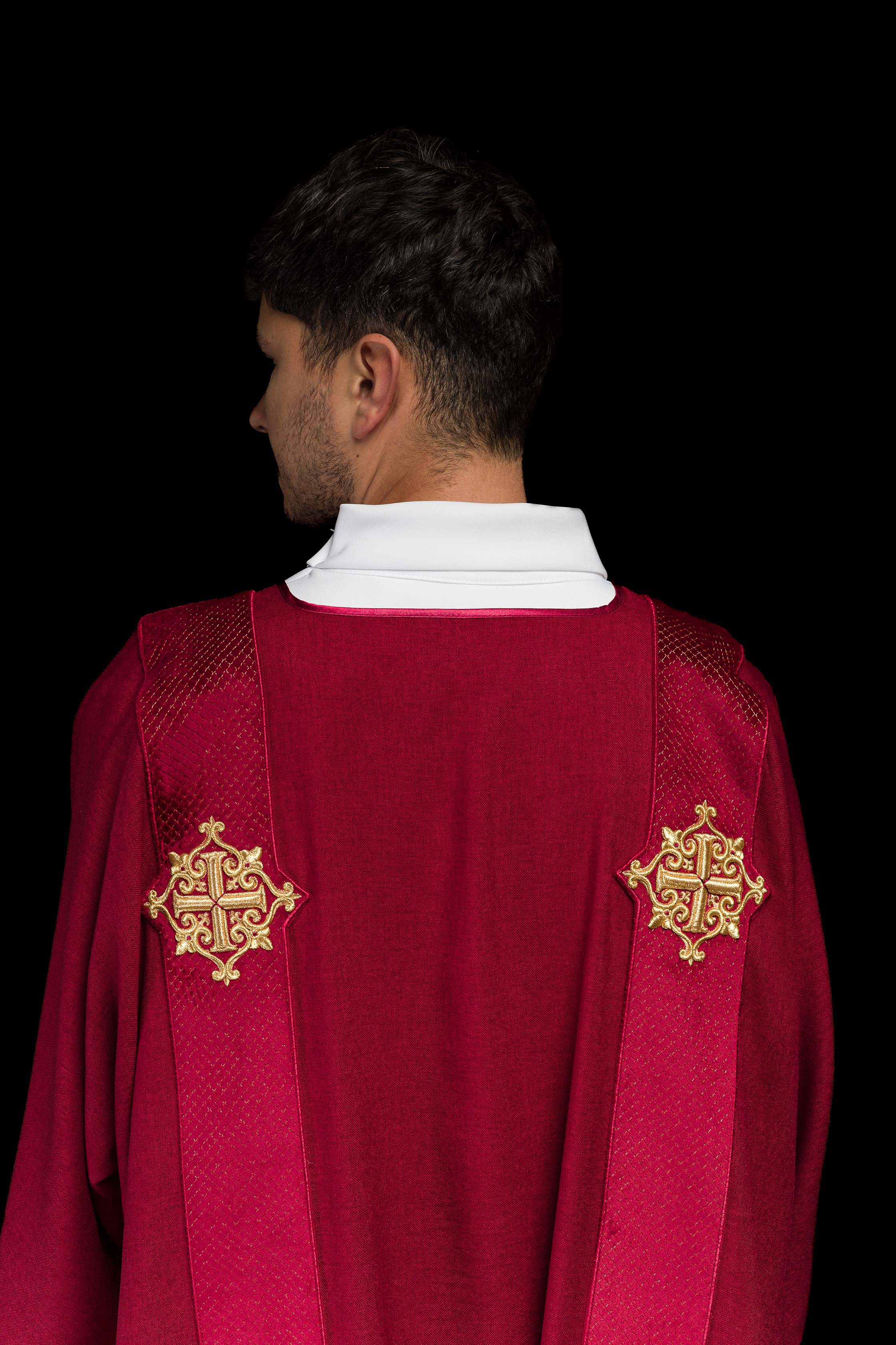 Red dalmatic with velvet bands and cross symbols
