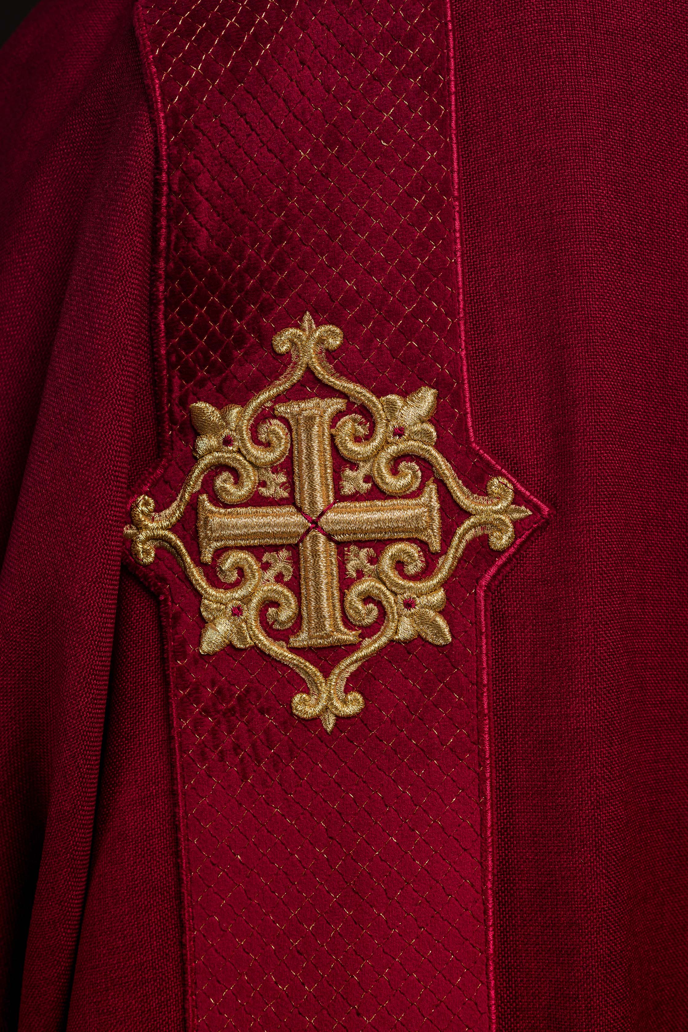 Red dalmatic with velvet bands and cross symbols