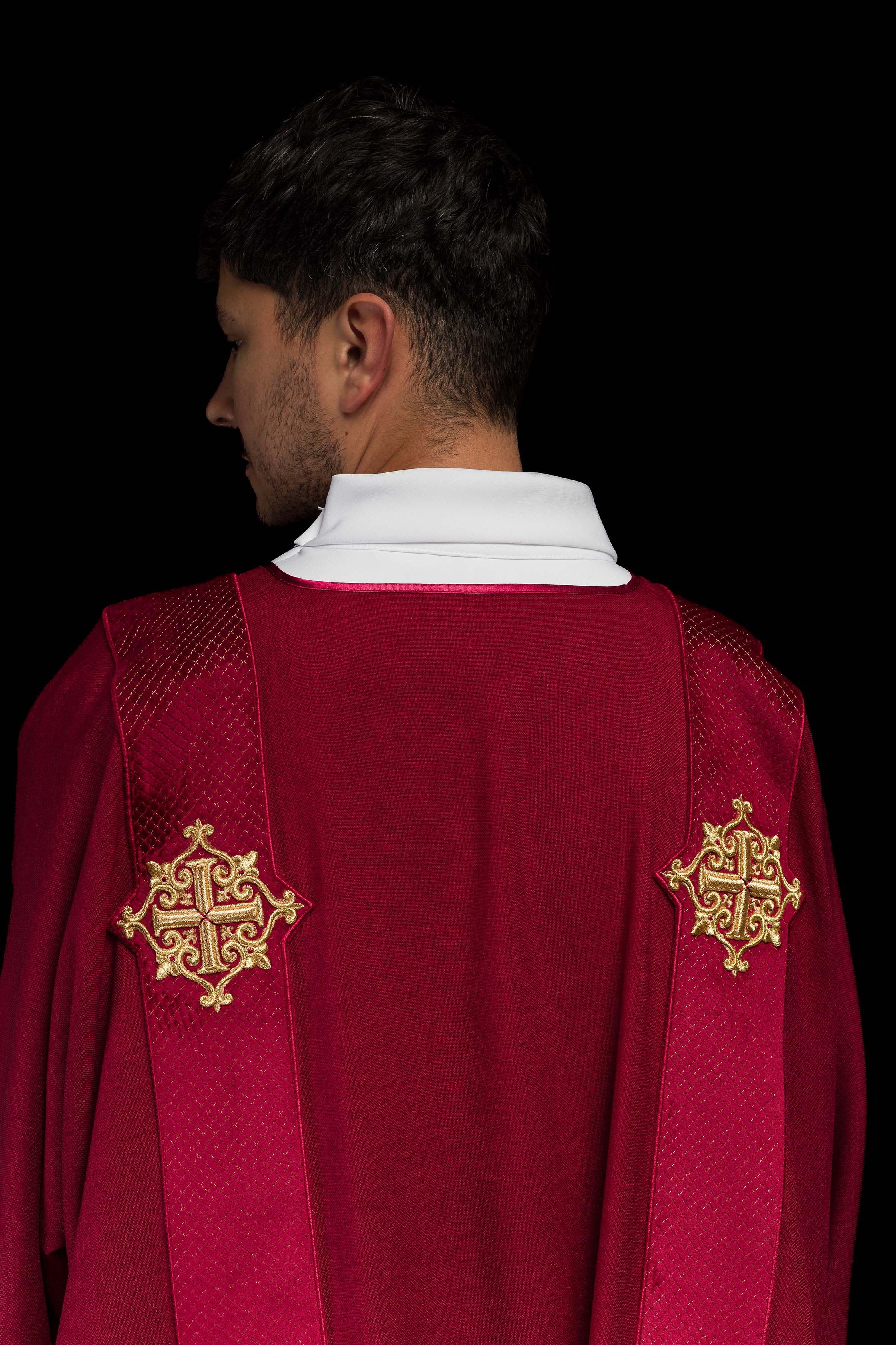 Red dalmatic with velvet bands and cross symbols