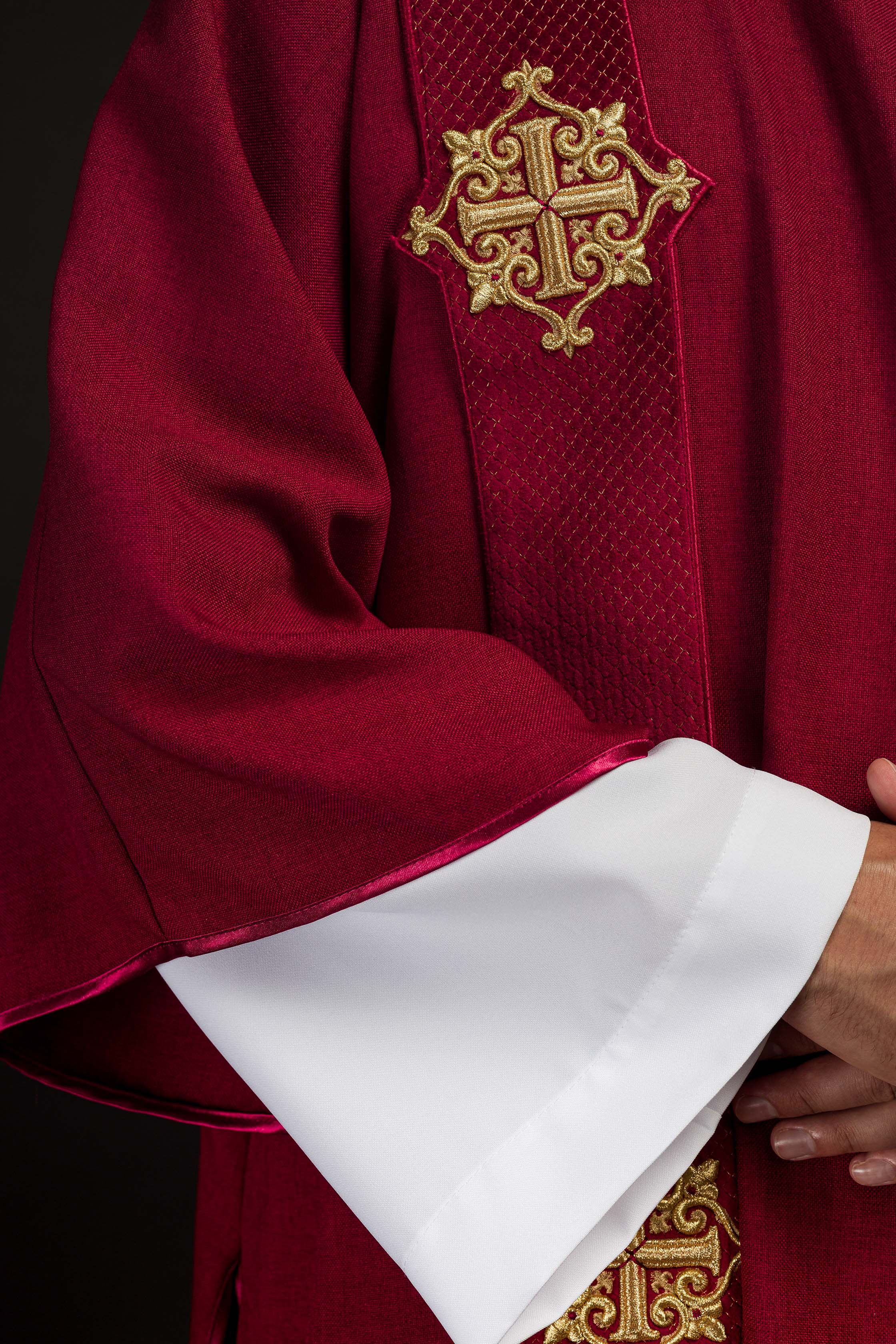 Red dalmatic with velvet bands and cross symbols