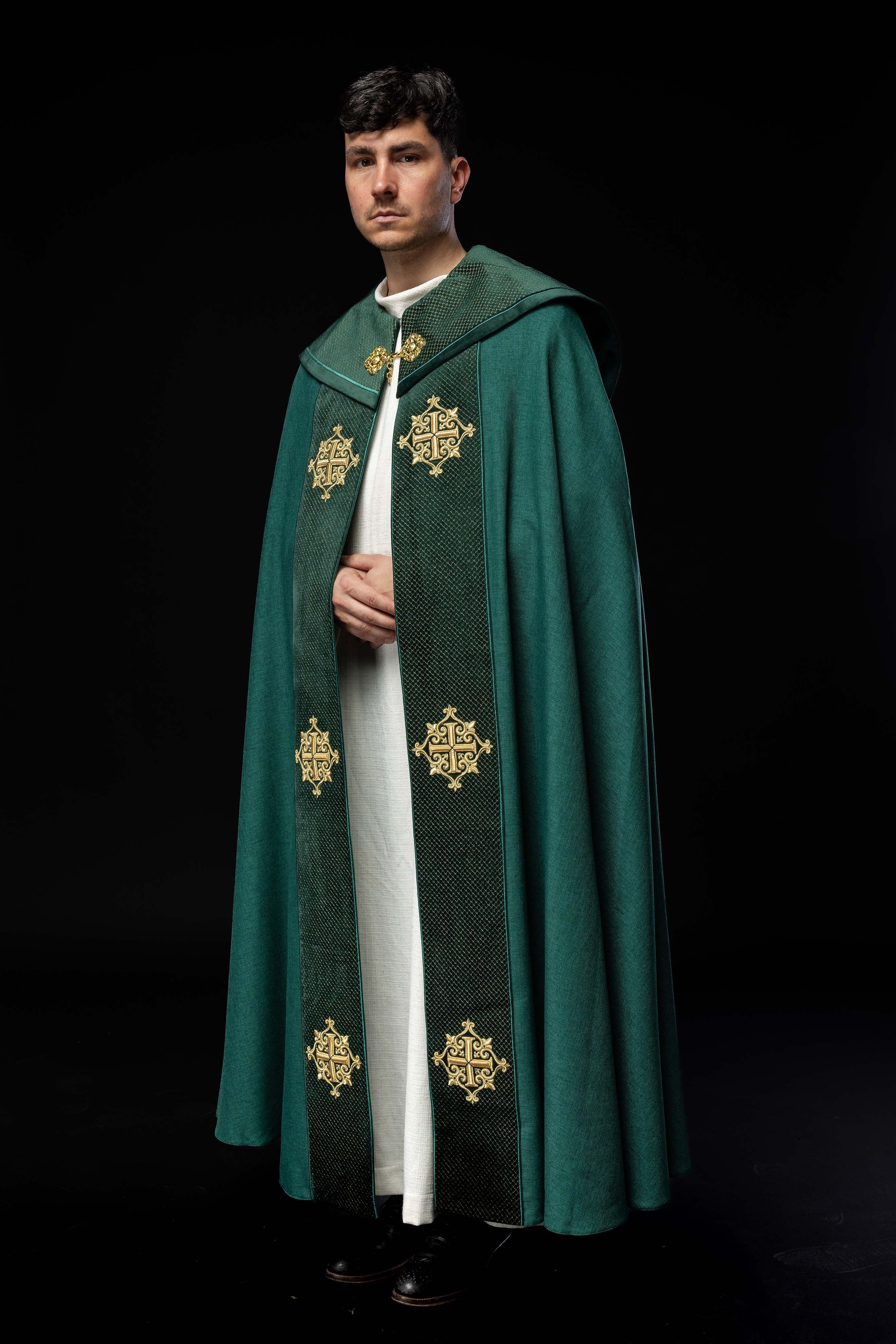 Green cope with a velvet sash and cross embroidery