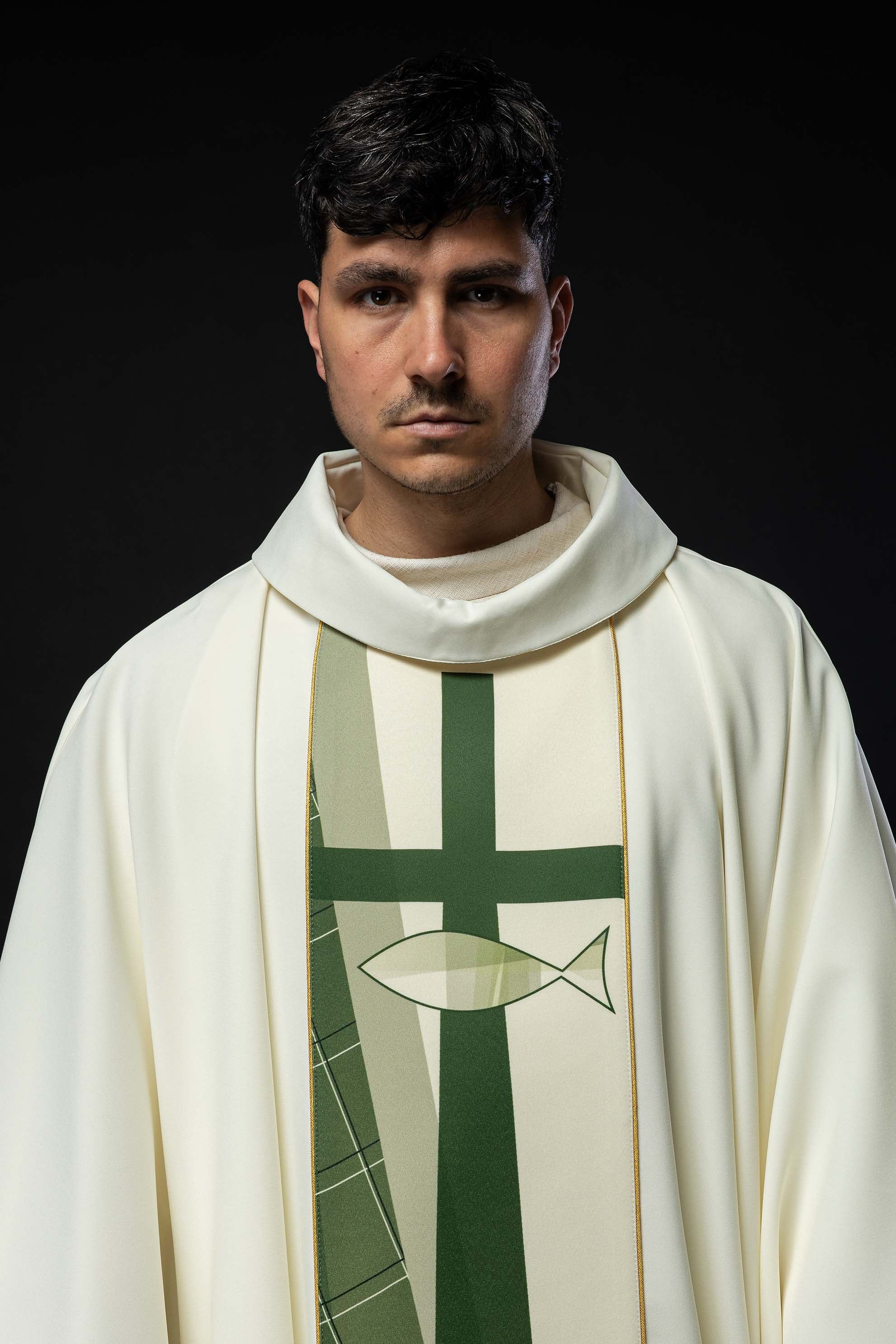 White chasuble embroidered with cross and fish patter