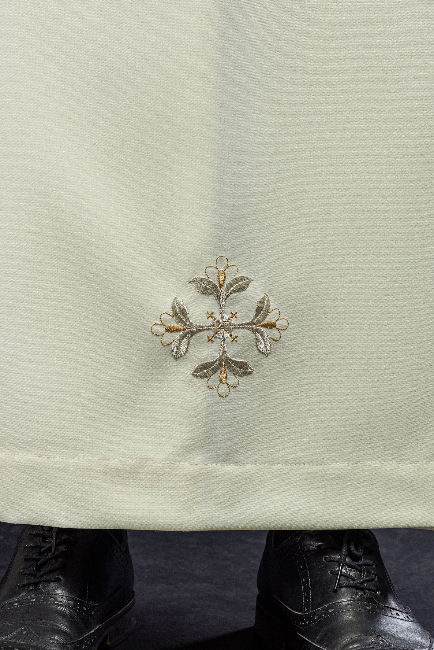 Cream alb with turtleneck and decorated embroidery