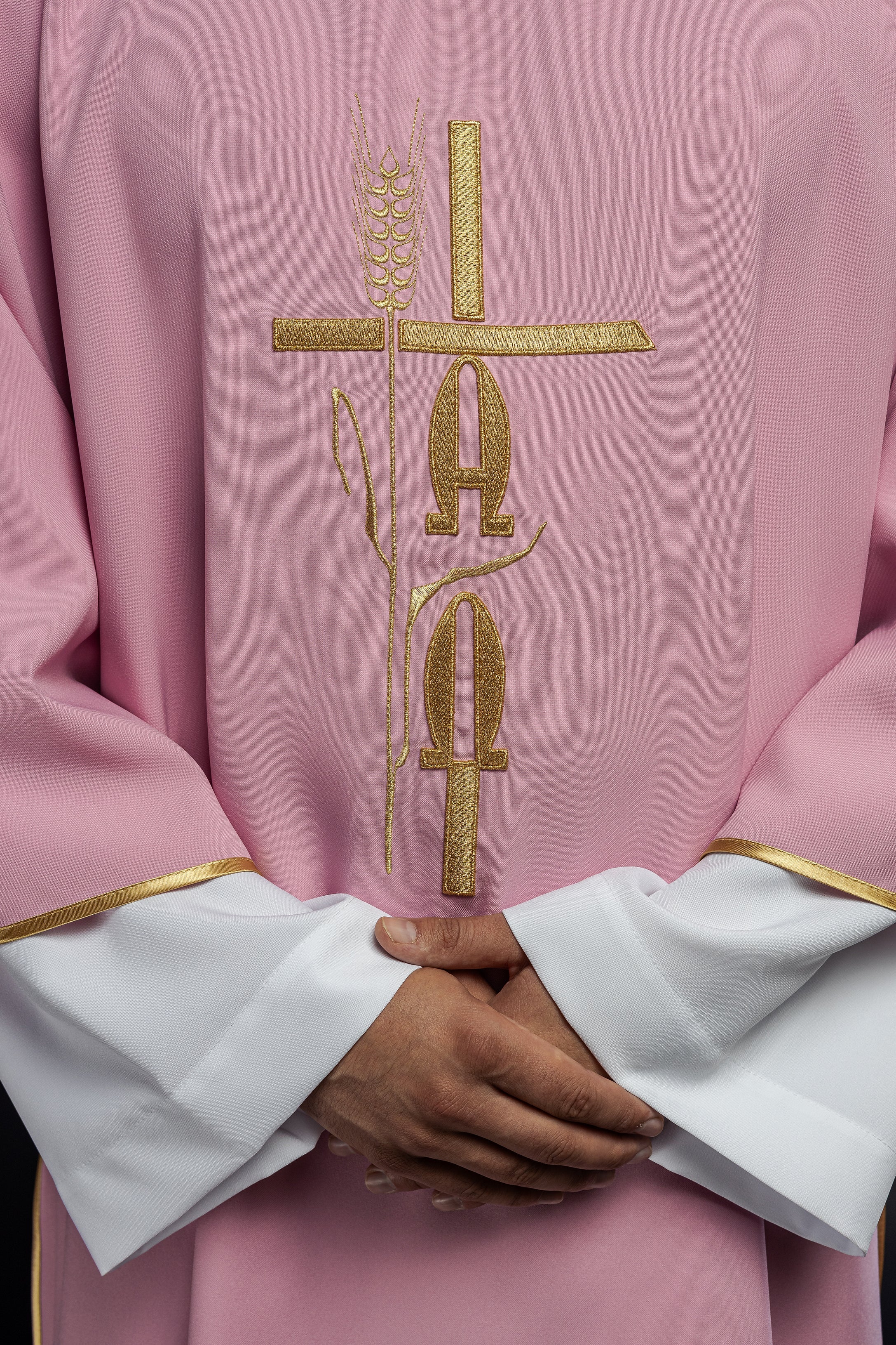 Pink deacon dalmatic with Alpha Omega embroidery