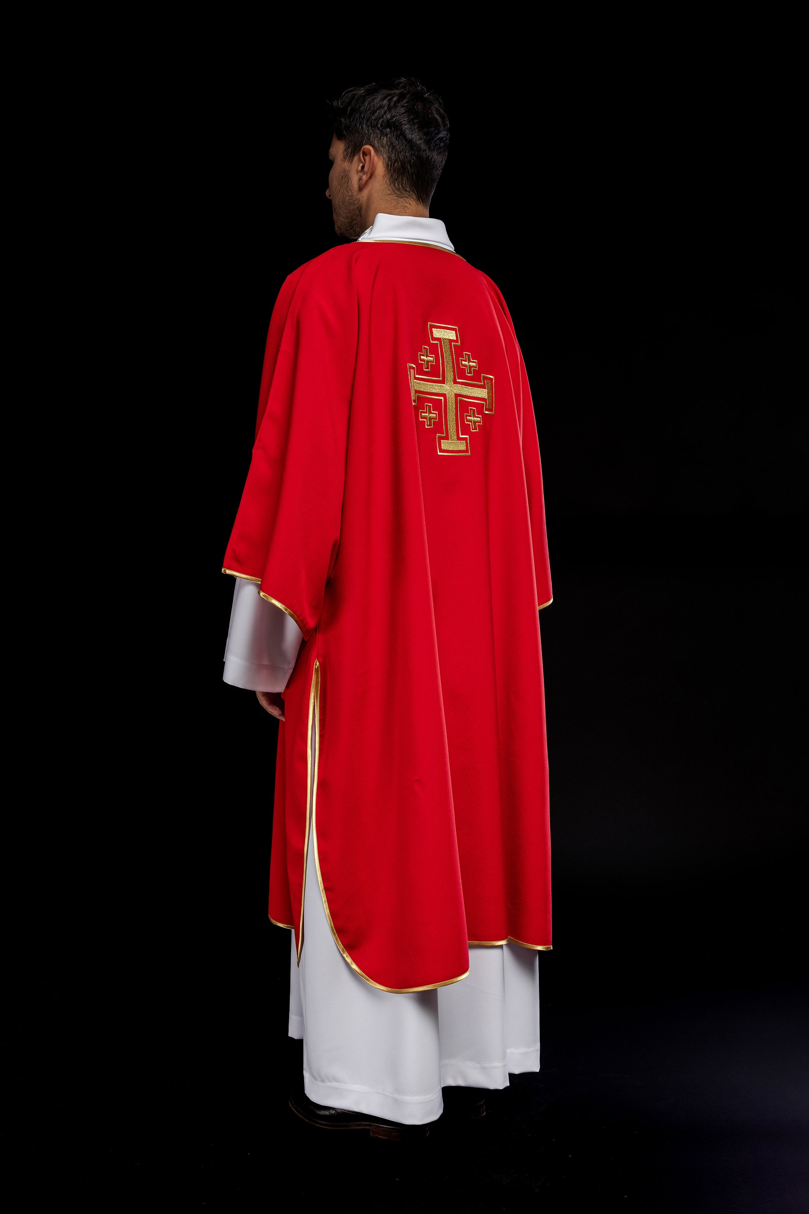 Red dalmatic priest with embroidered gold crosses