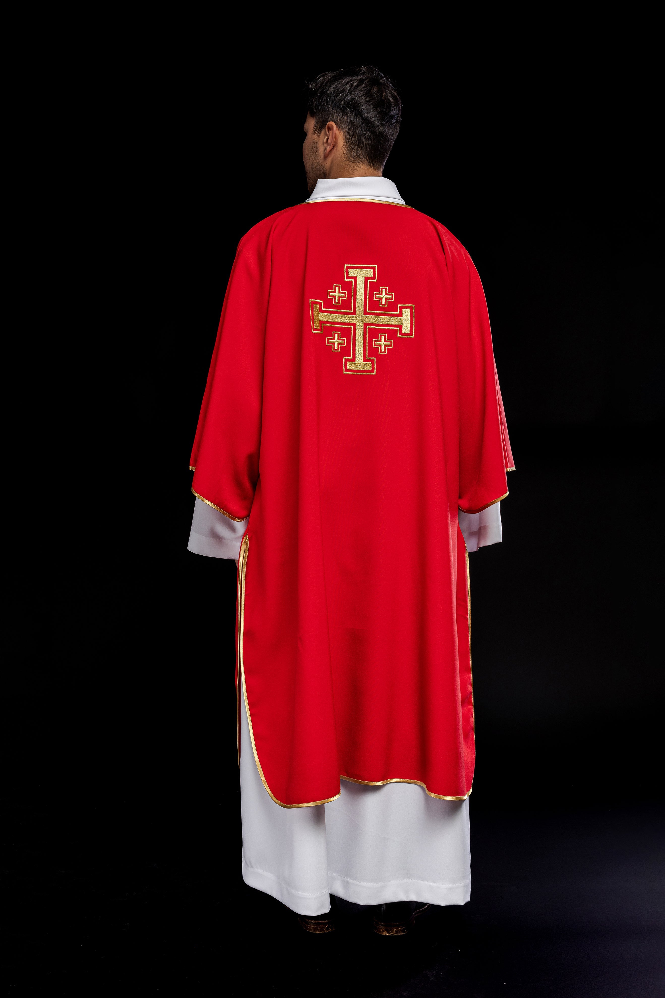 Red dalmatic priest with embroidered gold crosses