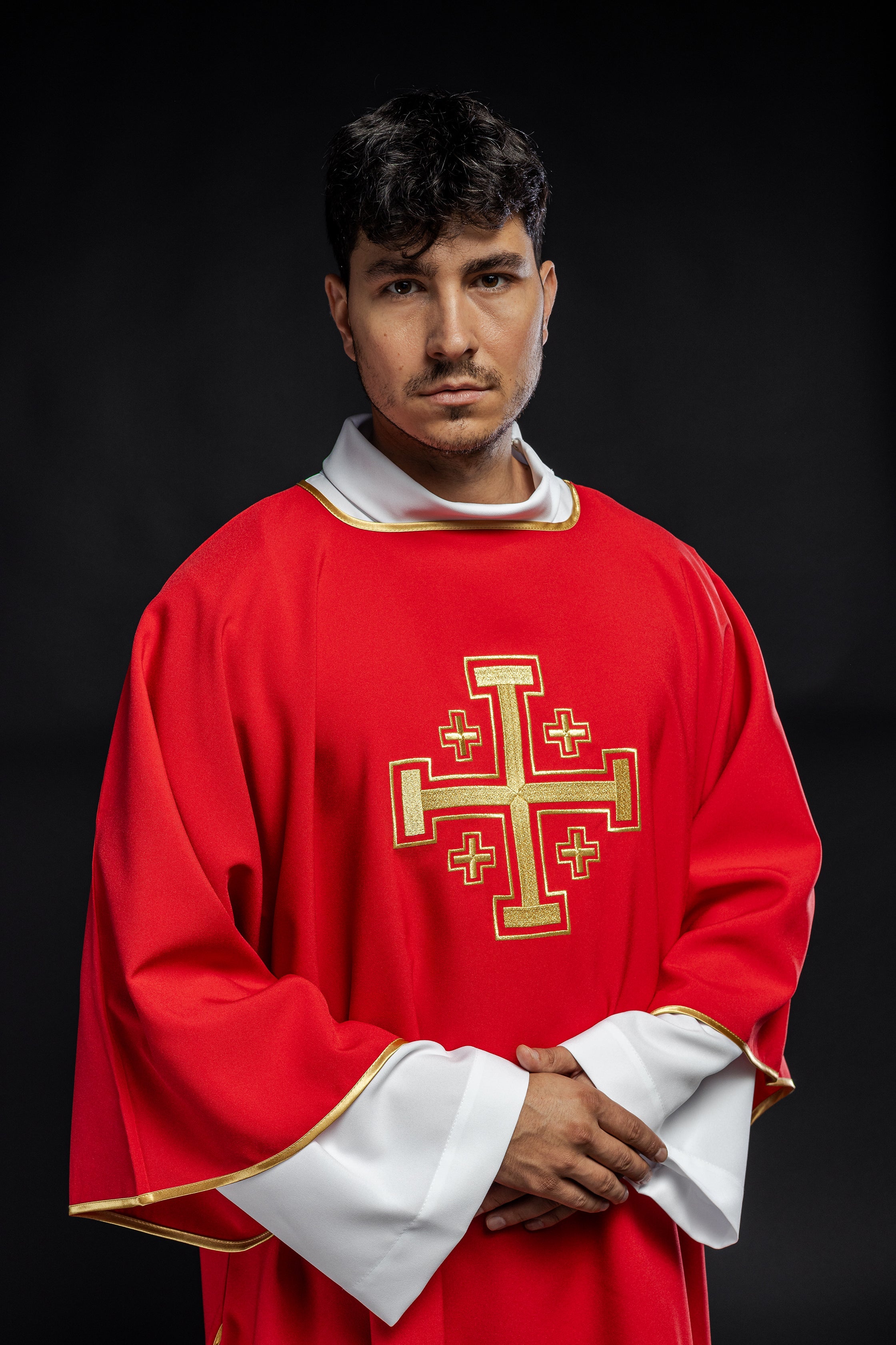 Red dalmatic priest with embroidered gold crosses