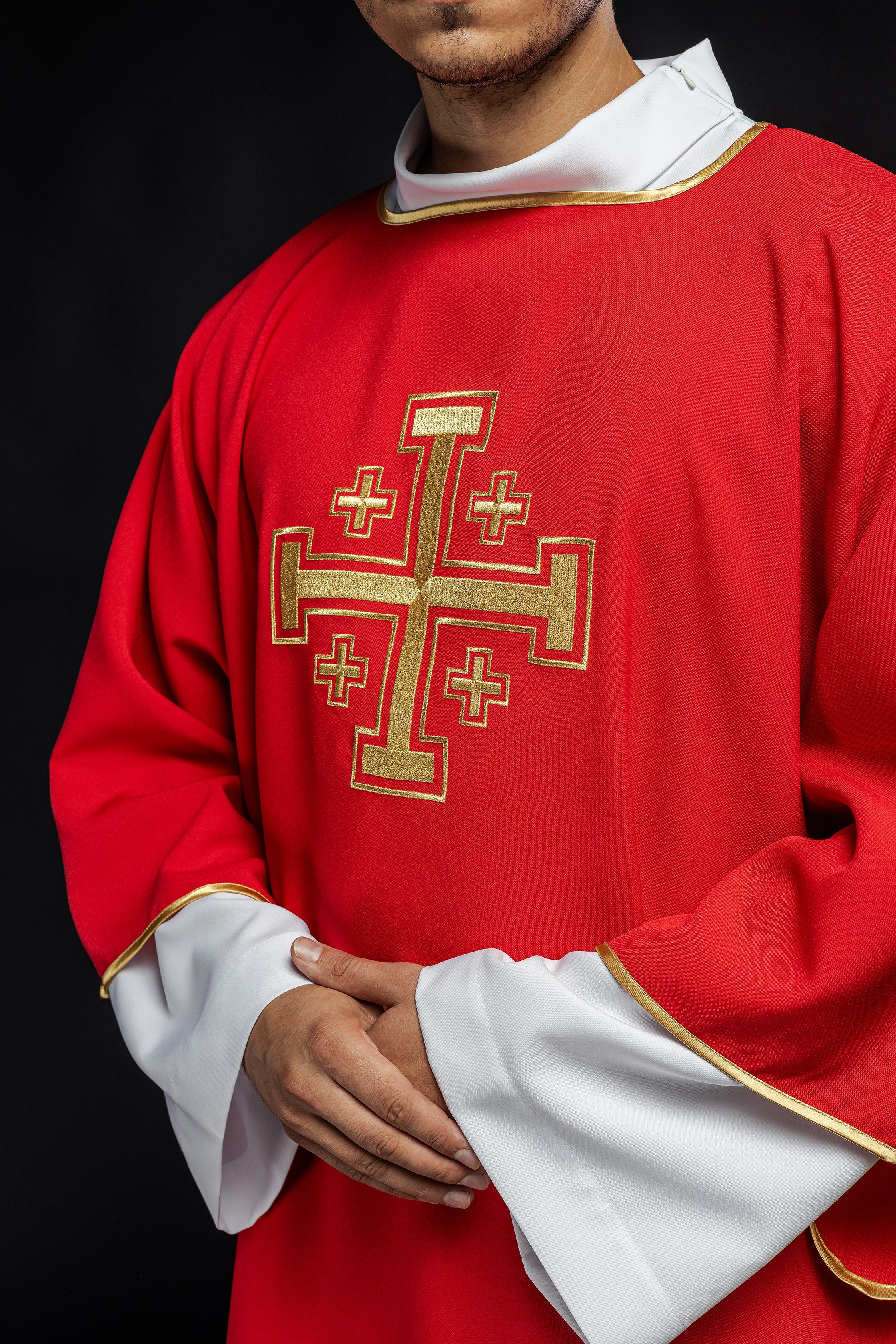 Red dalmatic priest with embroidered gold crosses