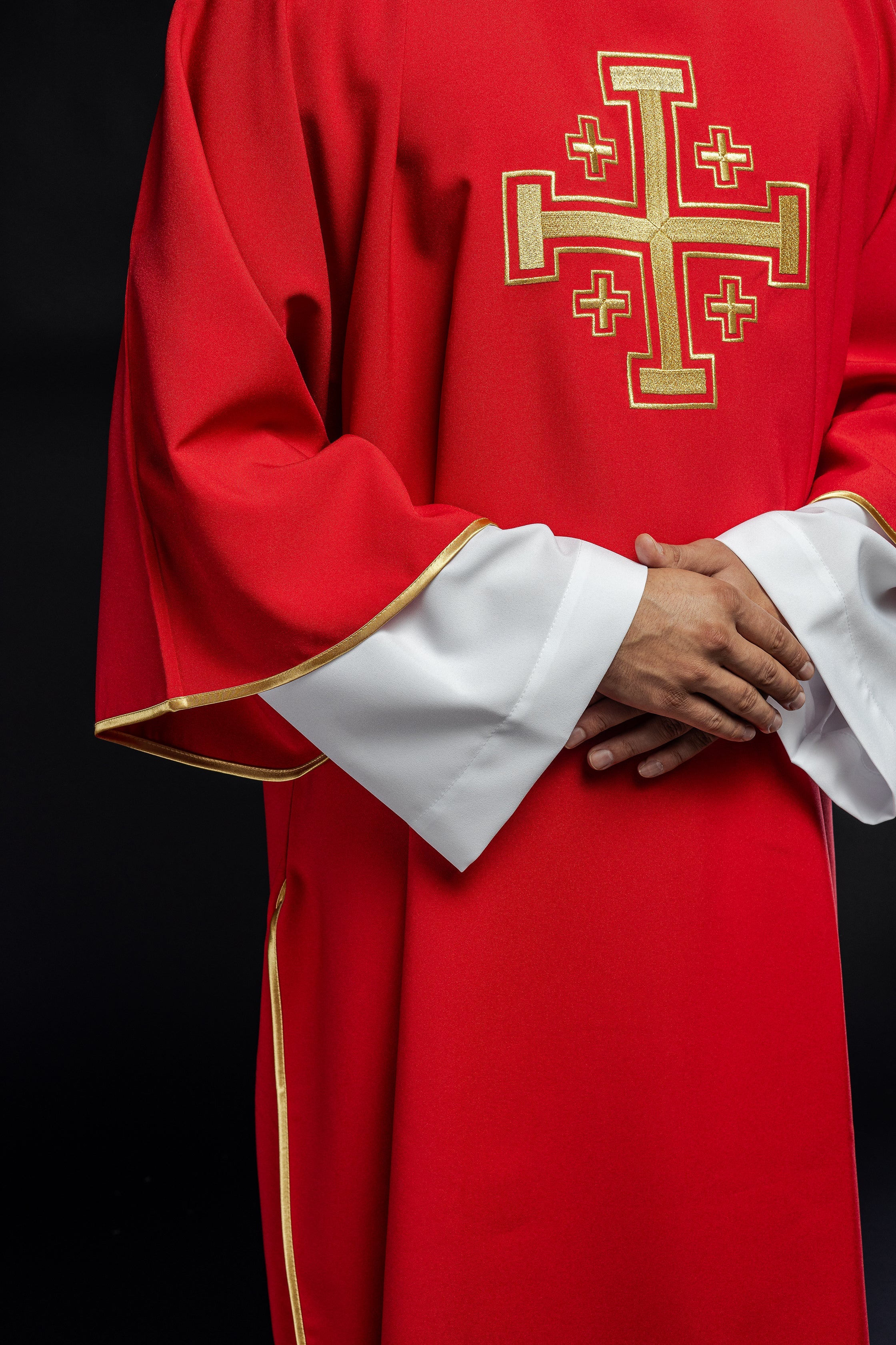 Red dalmatic priest with embroidered gold crosses