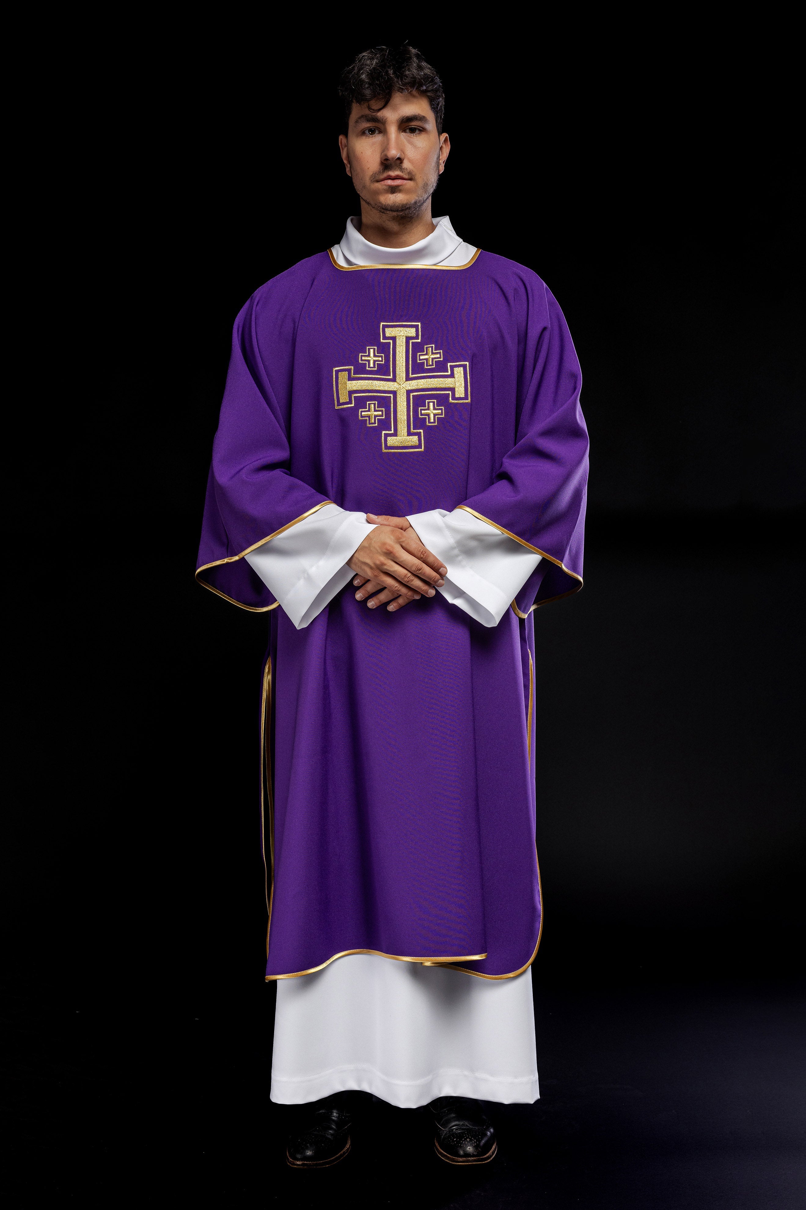 Purple dalmatic with embroidered gold crosses