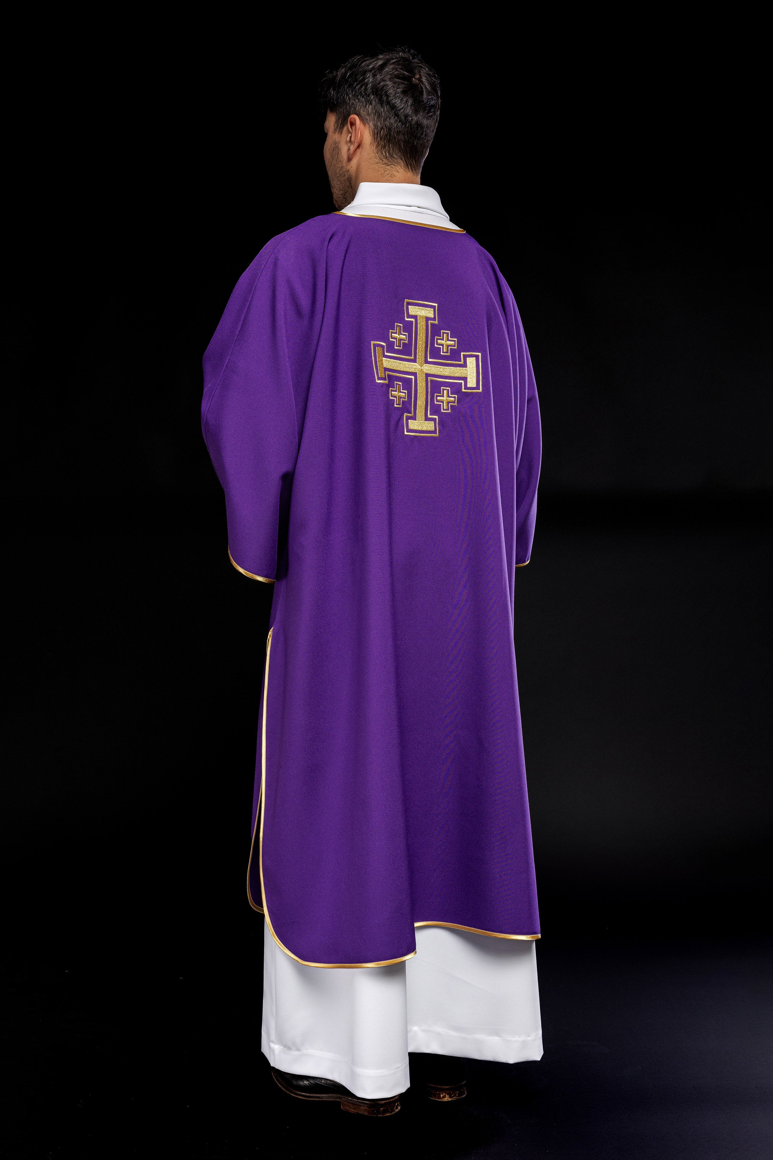 Purple dalmatic with embroidered gold crosses