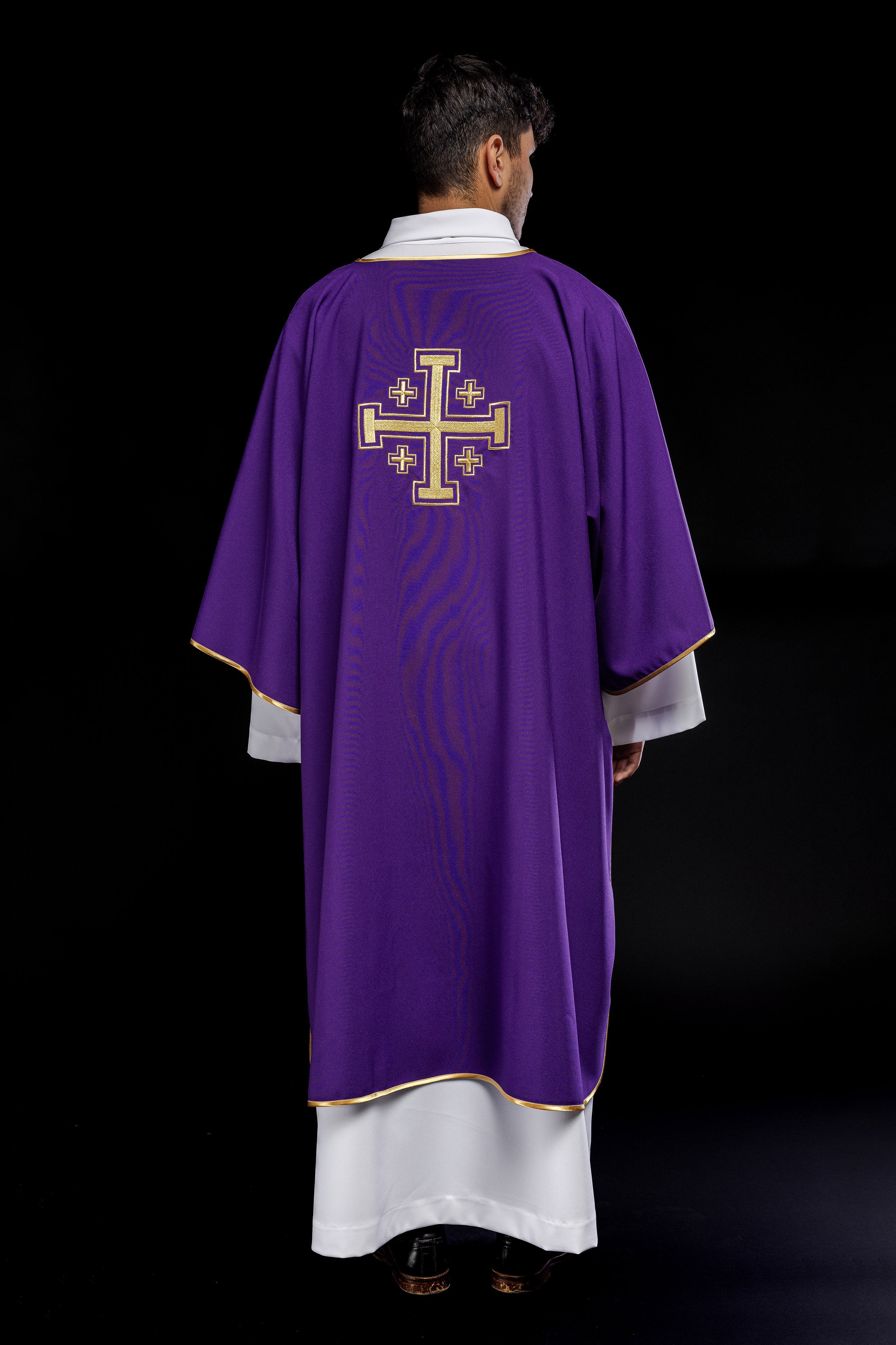 Purple dalmatic with embroidered gold crosses