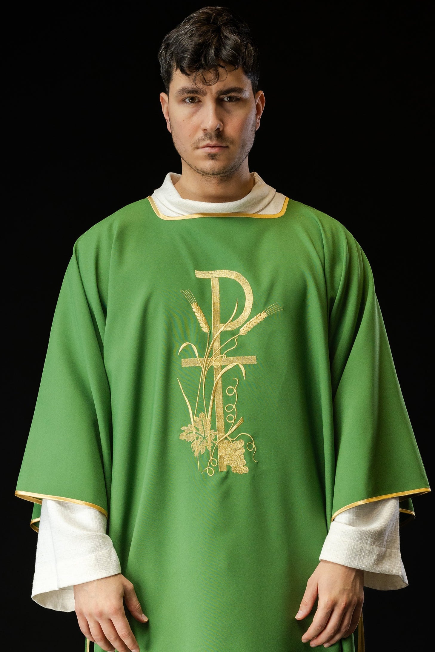 Green dalmatics with gold Pax cross embroidery