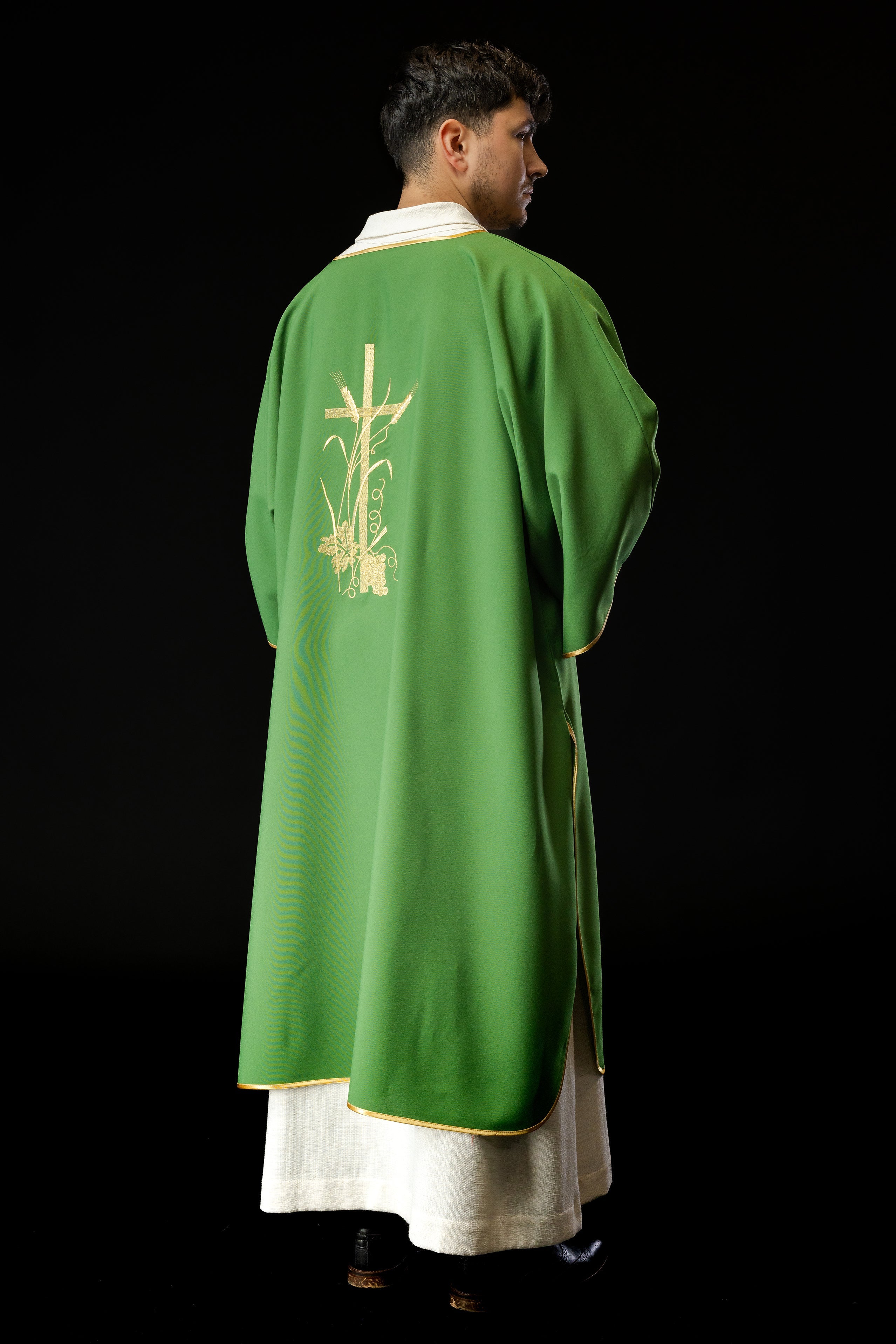 Green dalmatics with gold Pax cross embroidery