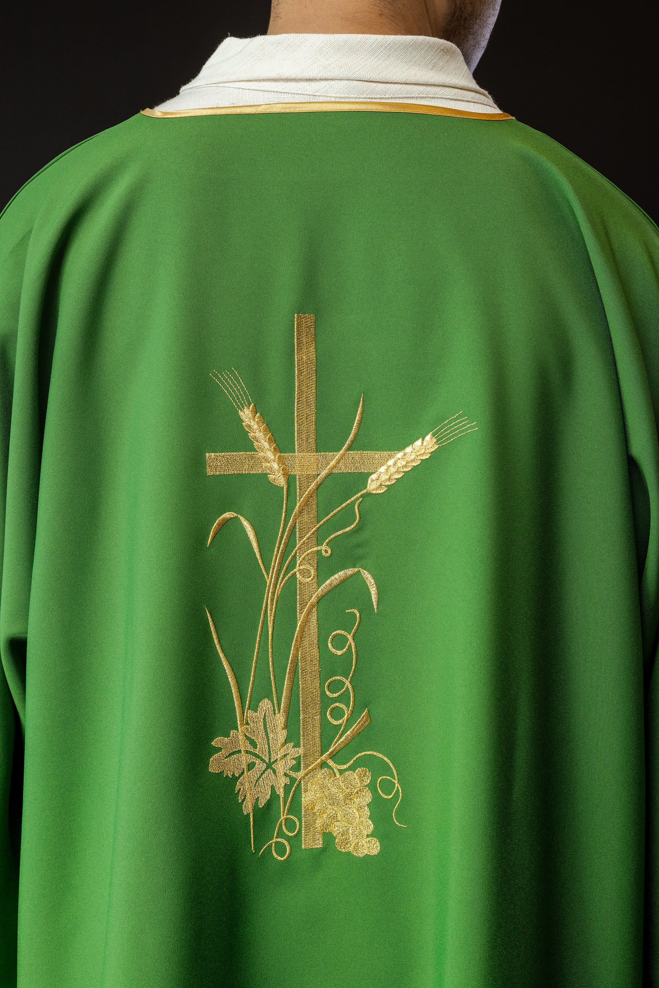 Green dalmatics with gold Pax cross embroidery