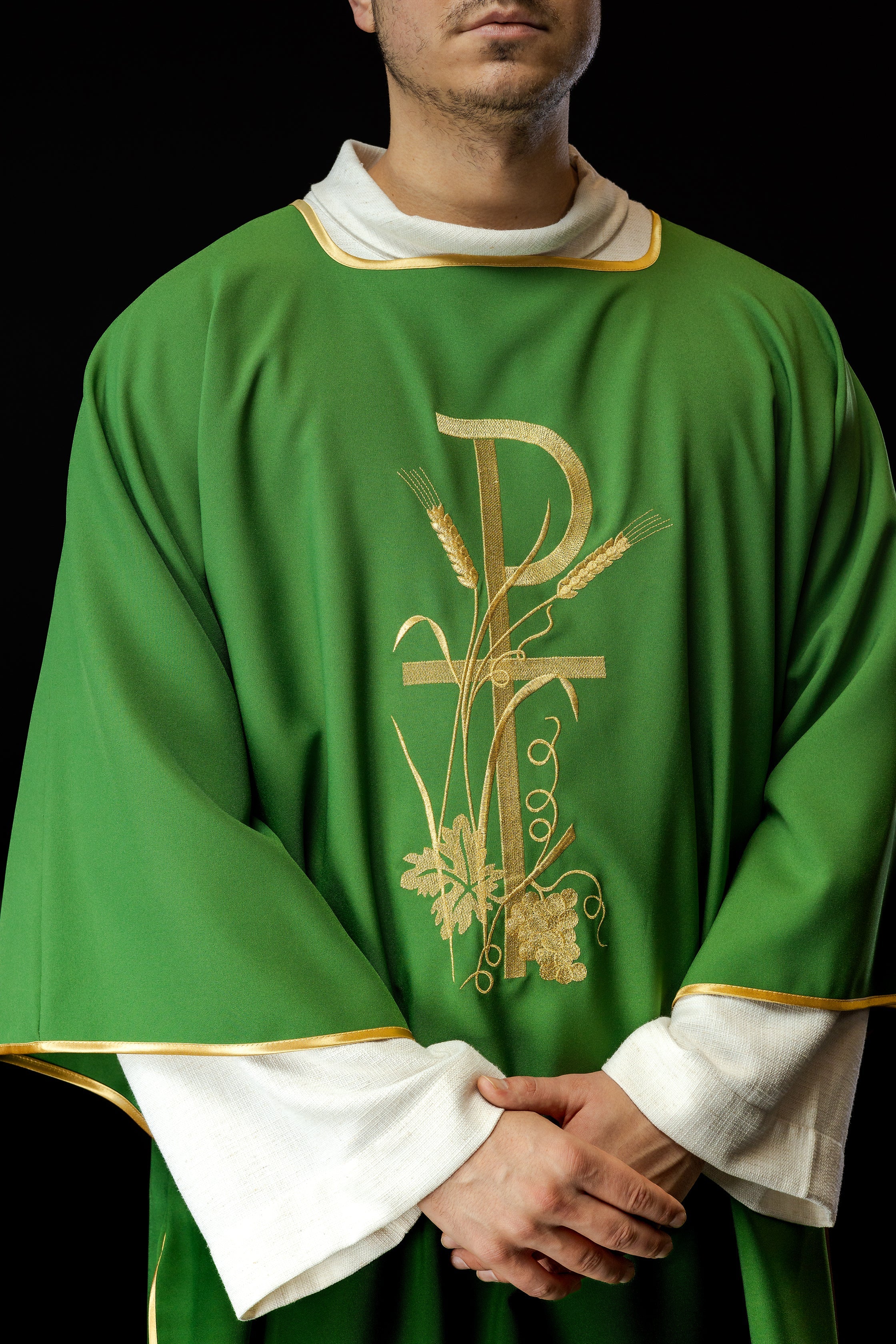 Green dalmatics with gold Pax cross embroidery