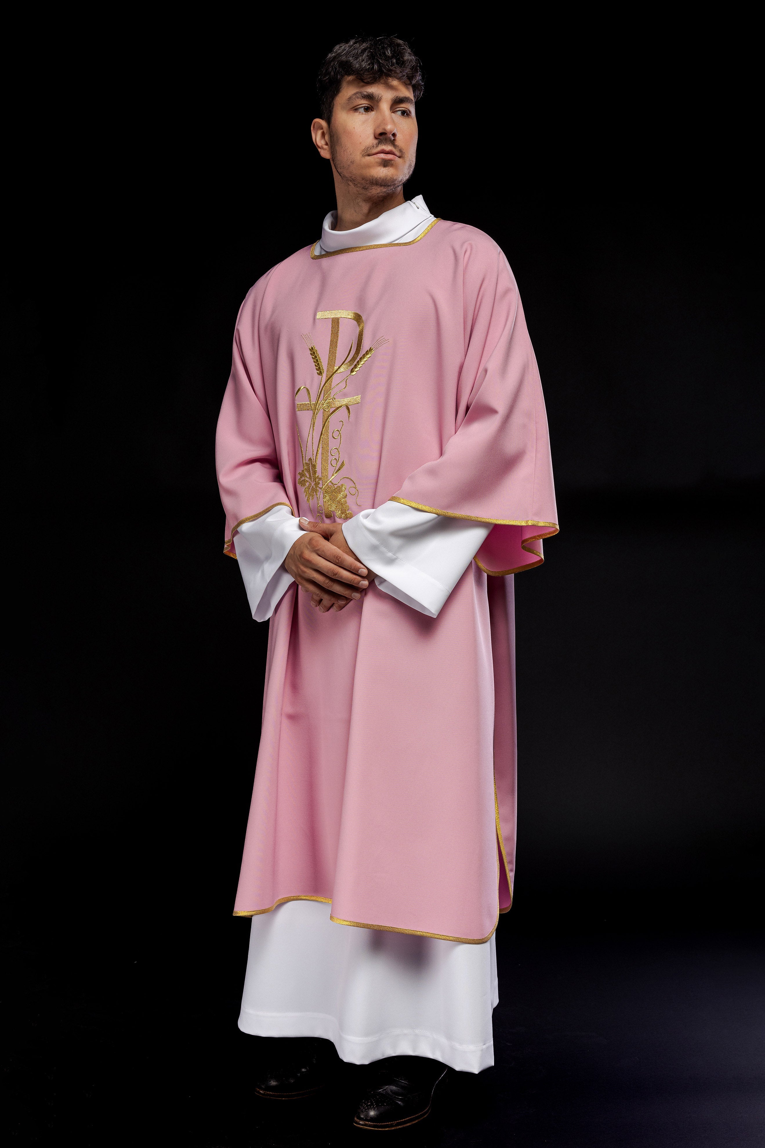 Pink dalmatic with gold Pax cross embroidery