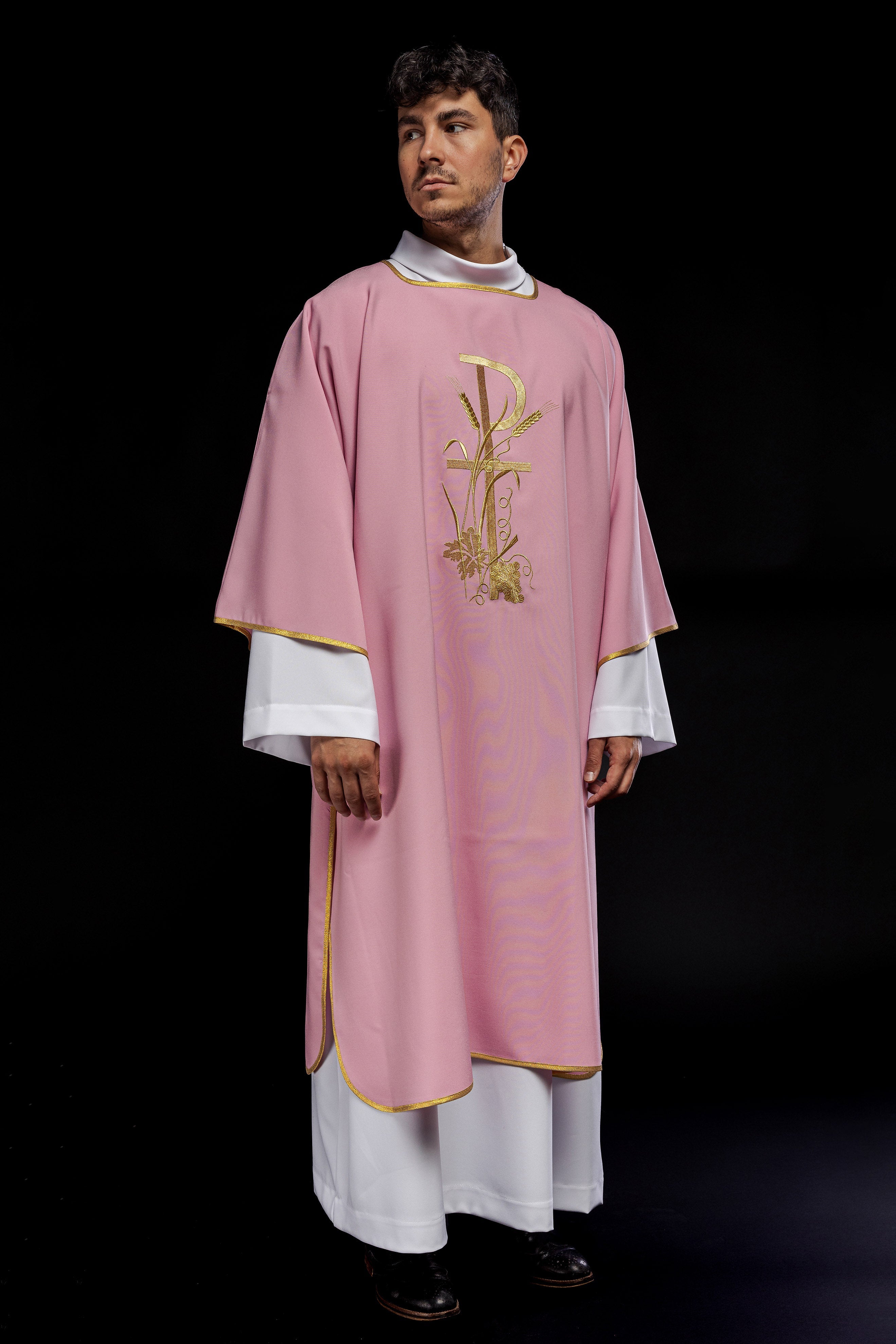 Pink dalmatic with gold Pax cross embroidery