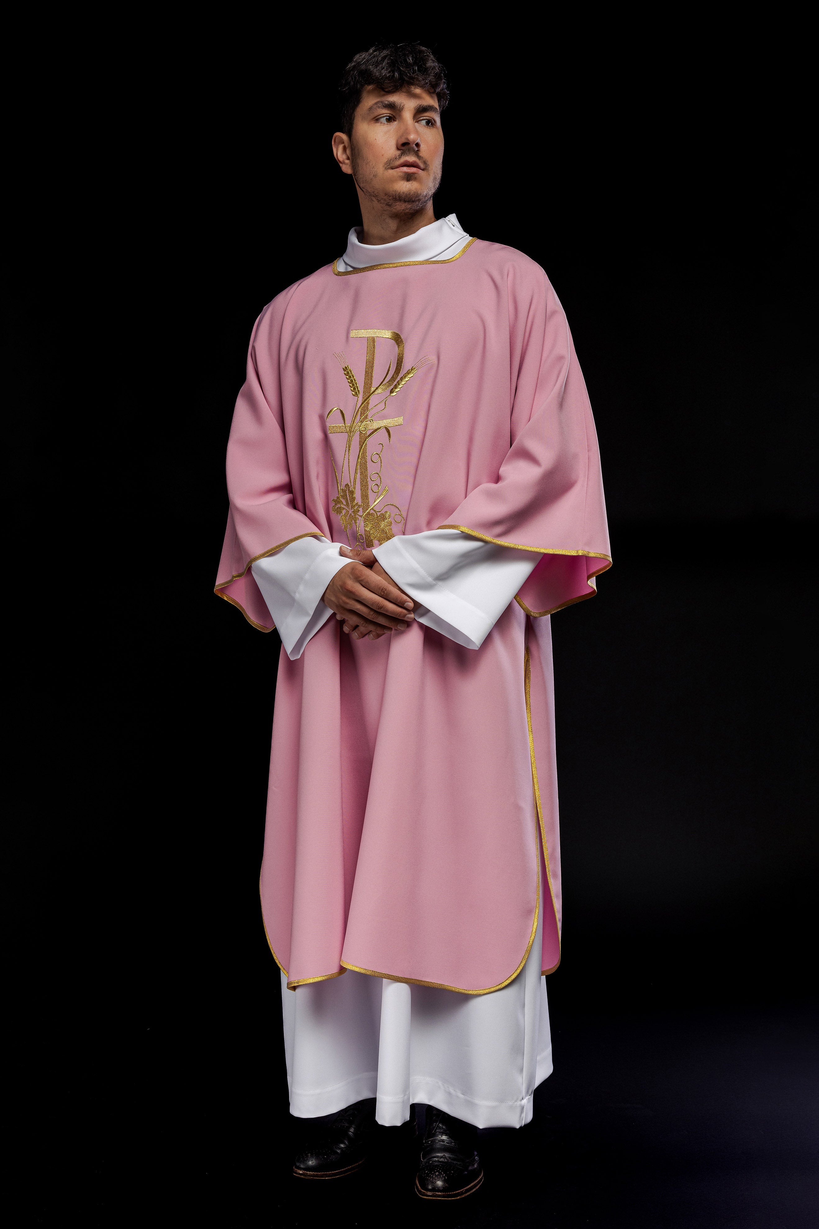 Pink dalmatic with gold Pax cross embroidery