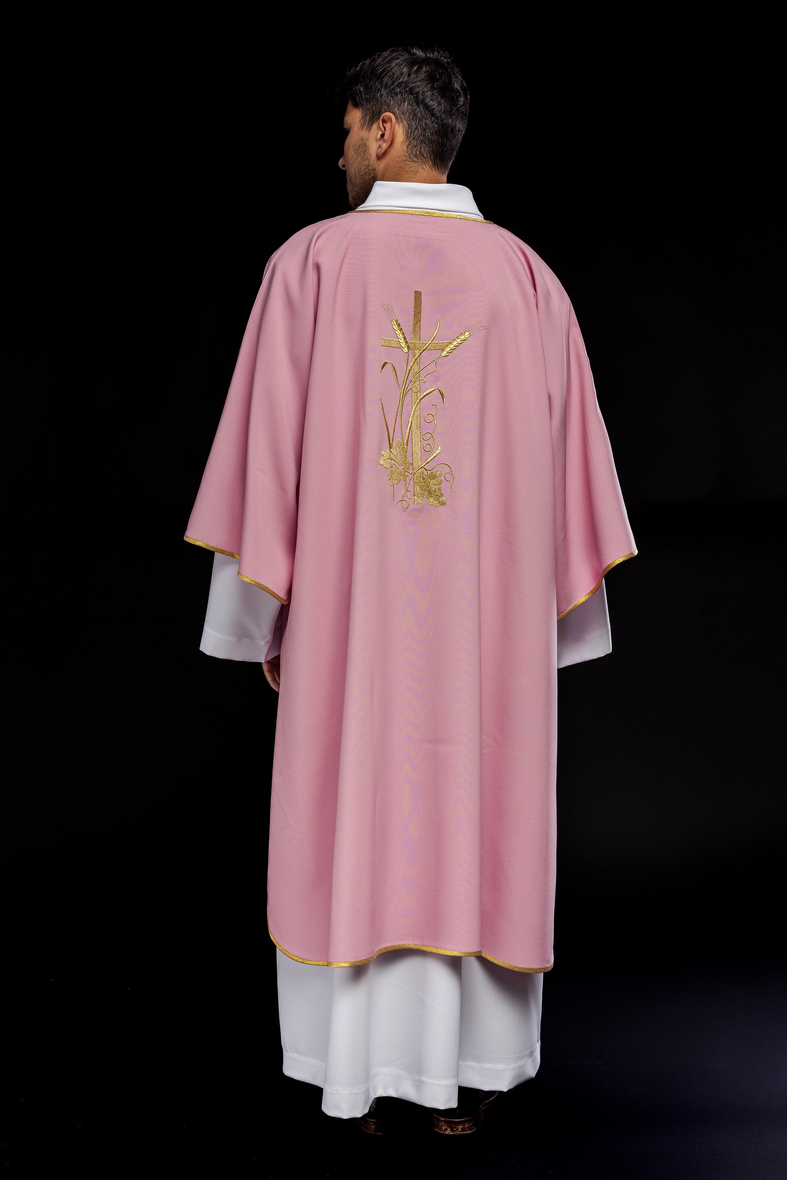 Pink dalmatic with gold Pax cross embroidery