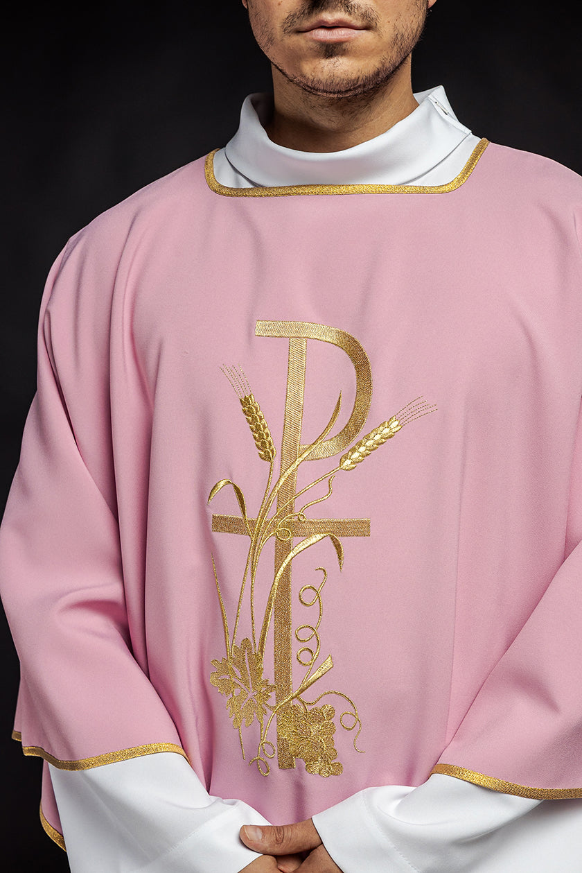 Pink dalmatic with gold Pax cross embroidery