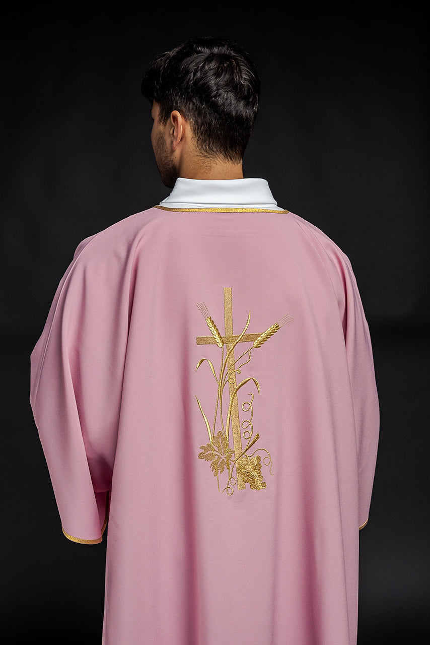 Pink dalmatic with gold Pax cross embroidery