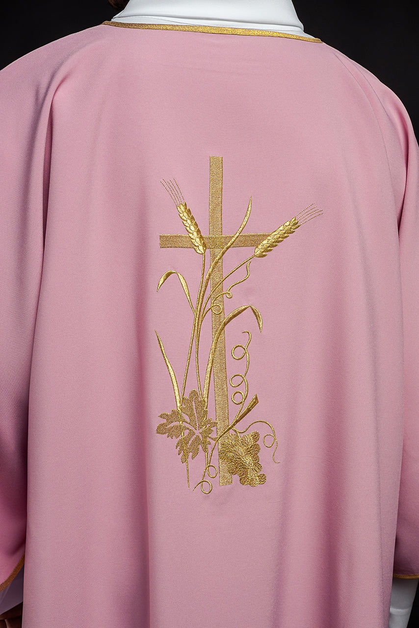 Pink dalmatic with gold Pax cross embroidery