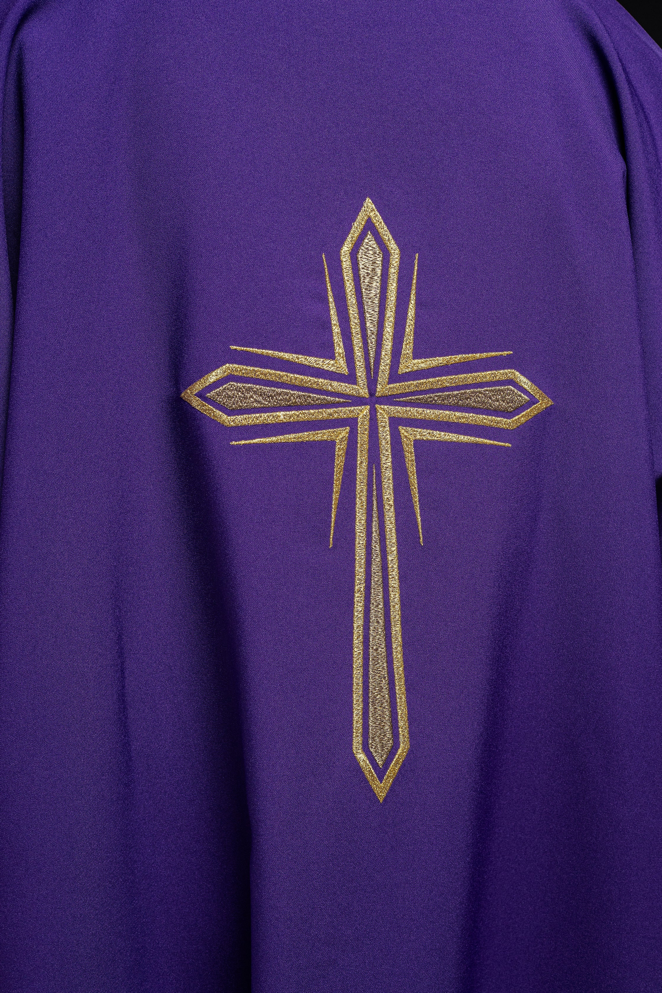 Purple dalmatic with embroidered gold cross