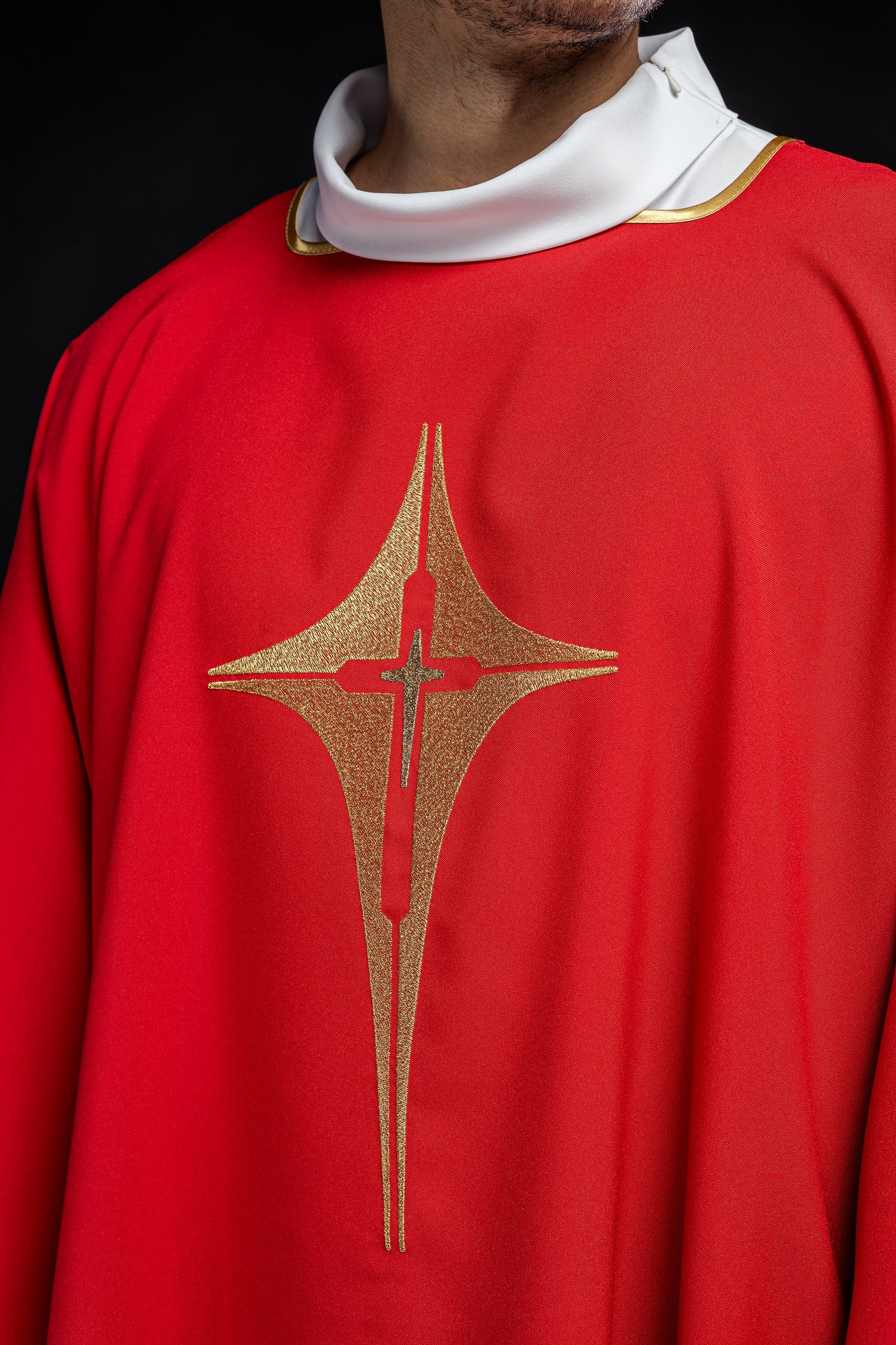 Red liturgical dalmatic with gold cross