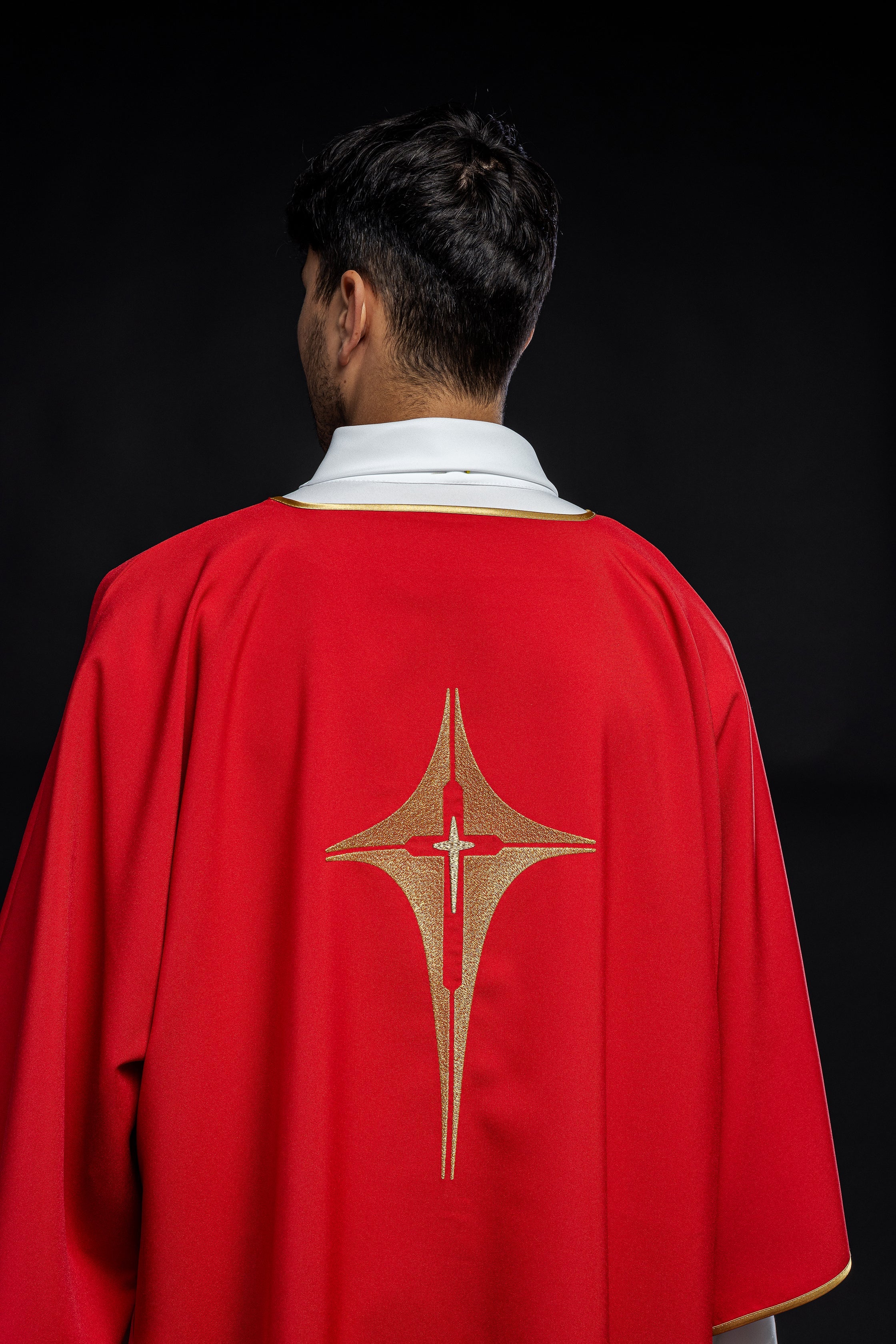 Red liturgical dalmatic with gold cross