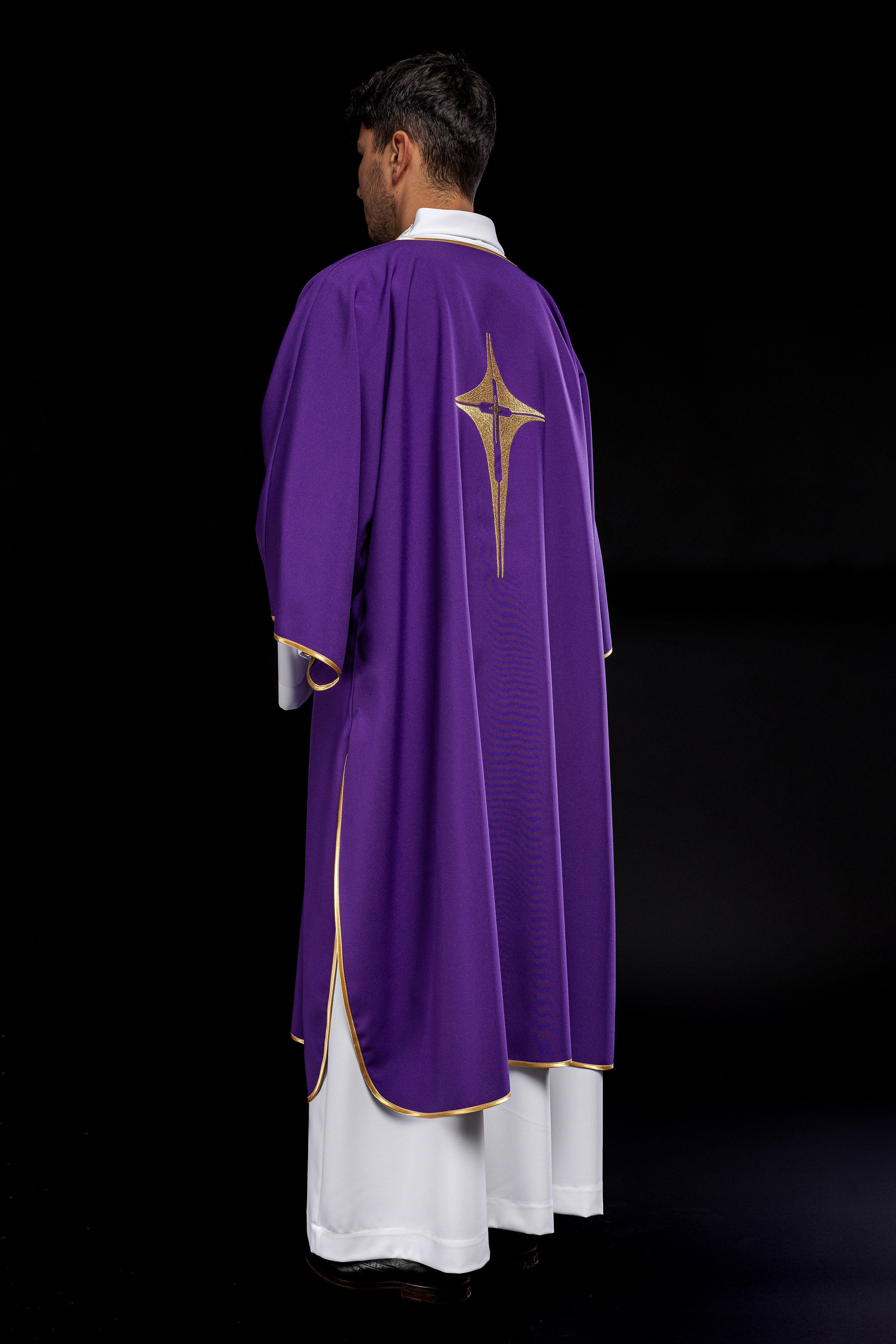 Purple liturgical dalmatic with embroidered gold cross