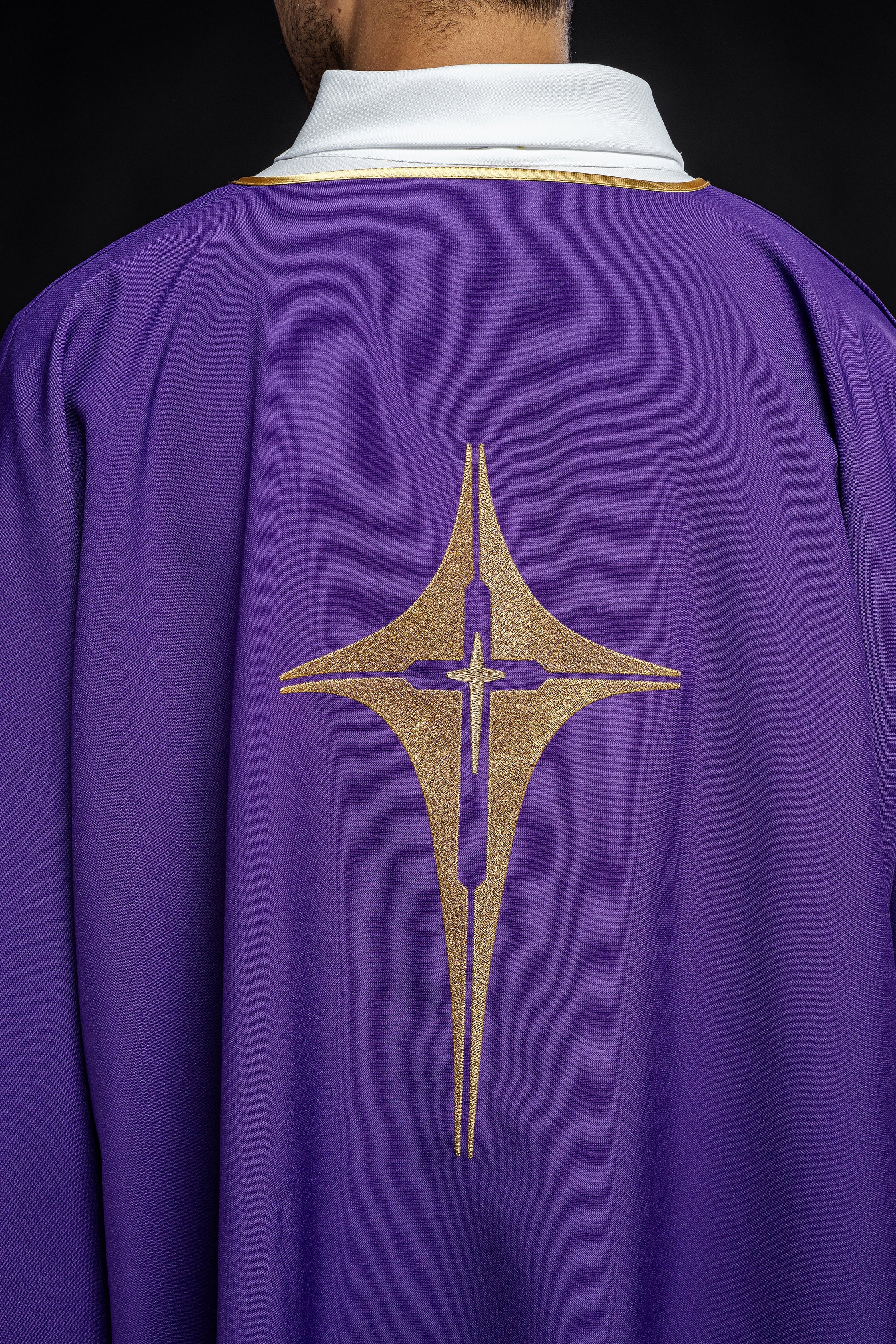 Purple liturgical dalmatic with embroidered gold cross